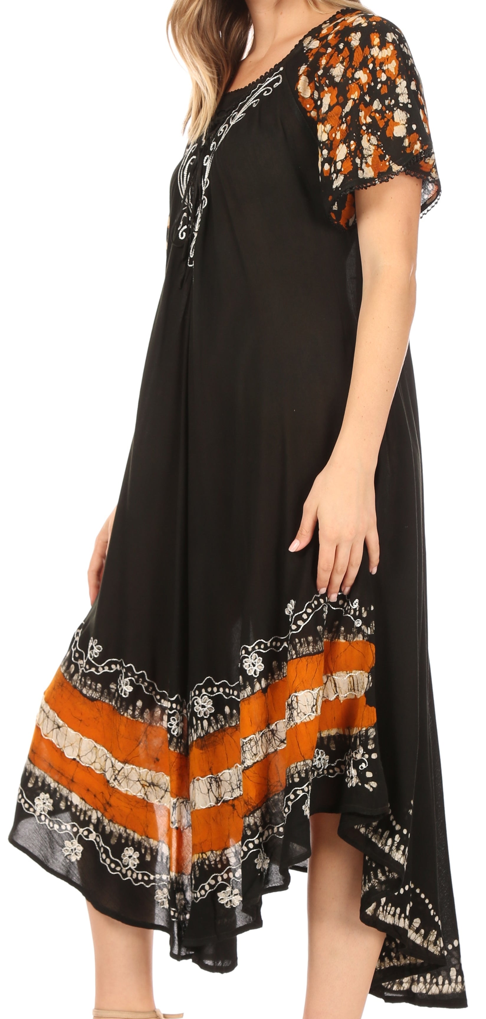 Black dress with orange and white patterns on a white background