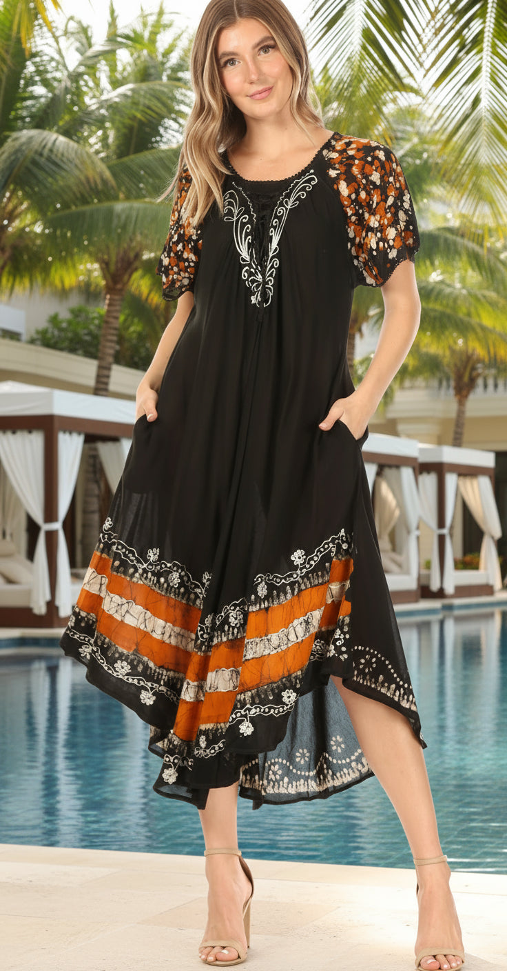 Woman wearing a black dress with orange and white patterns on a white background