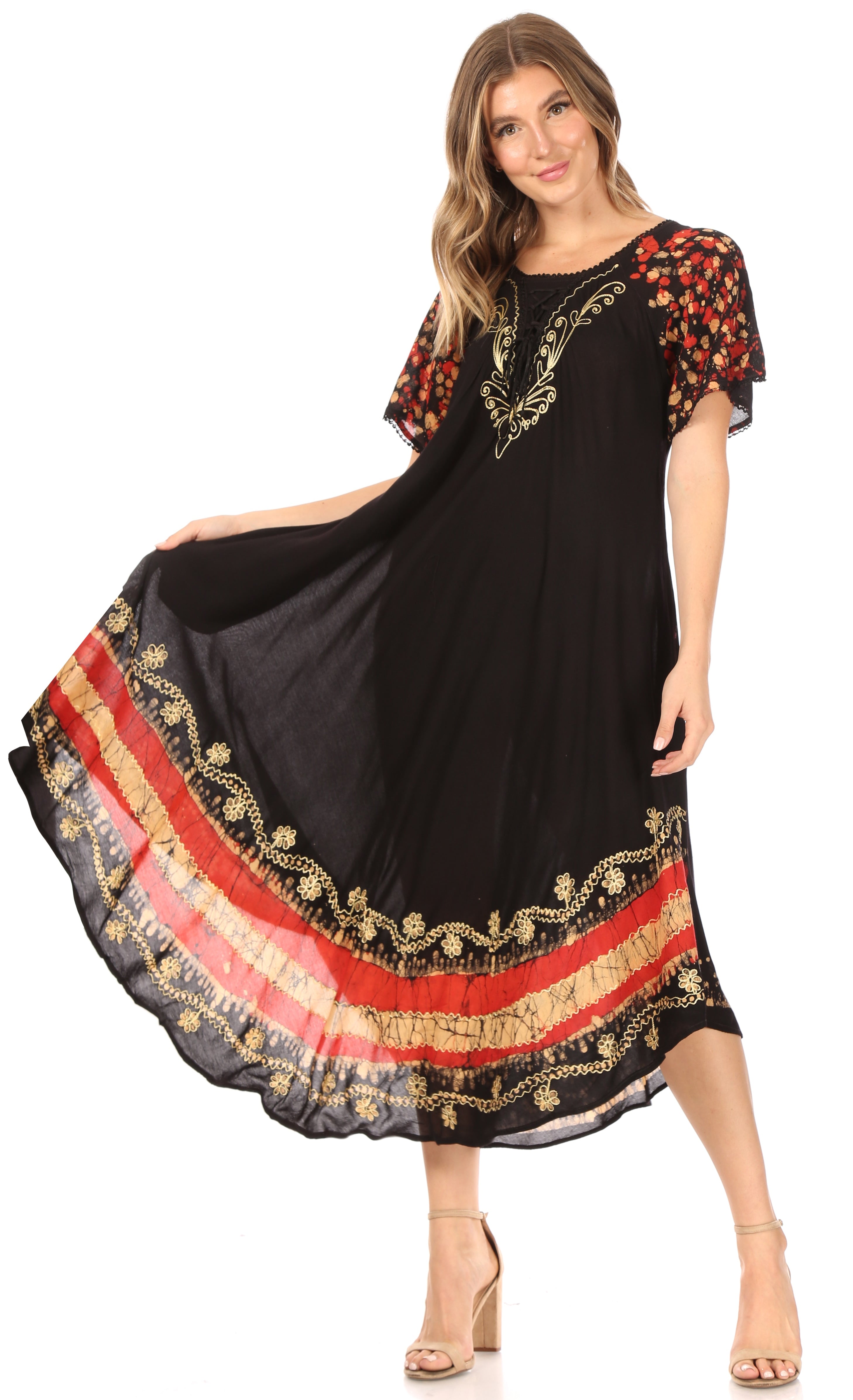 Woman wearing a black dress with red and gold patterns on a white background