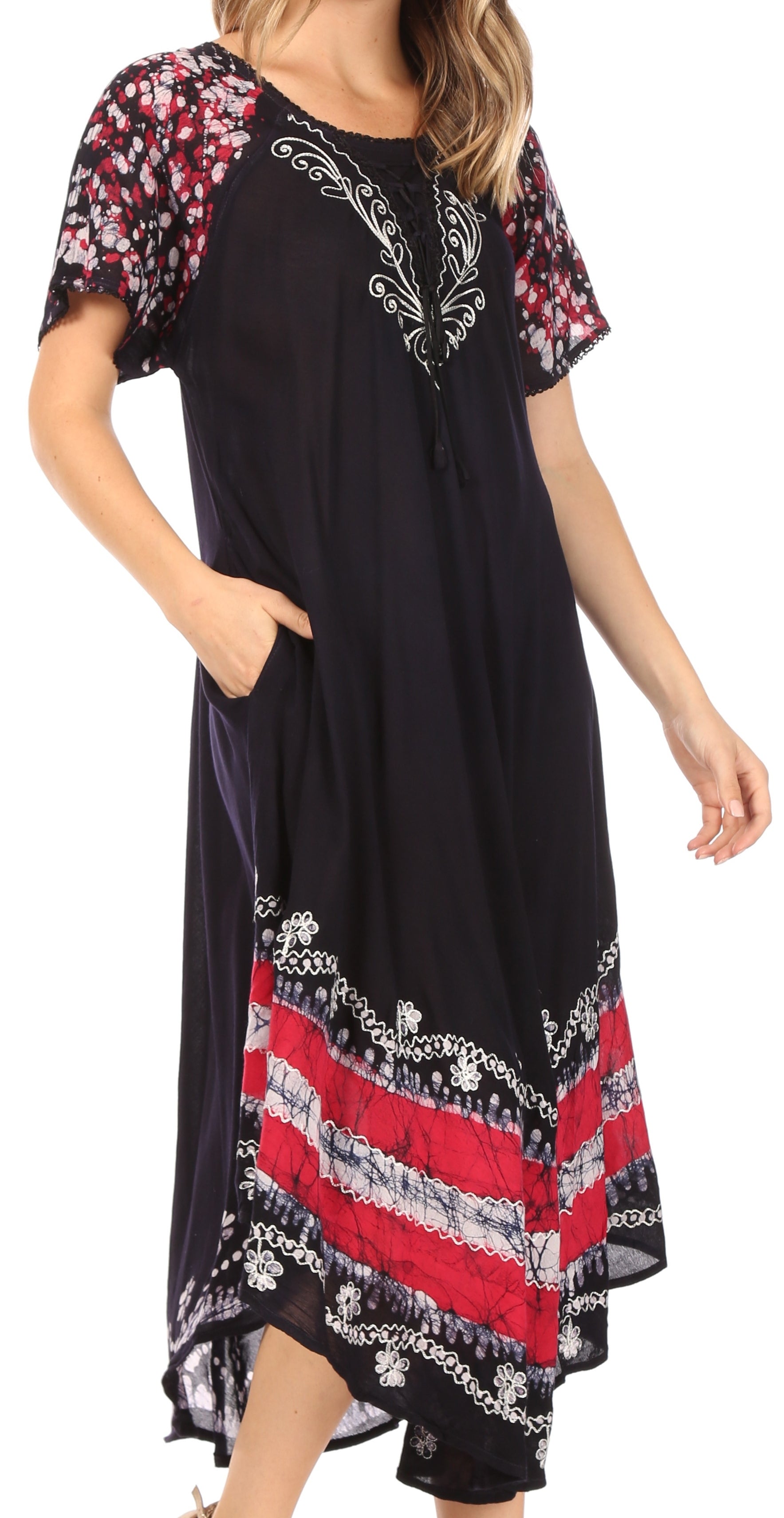 Black dress with colorful patterned sleeves and hem on a white background