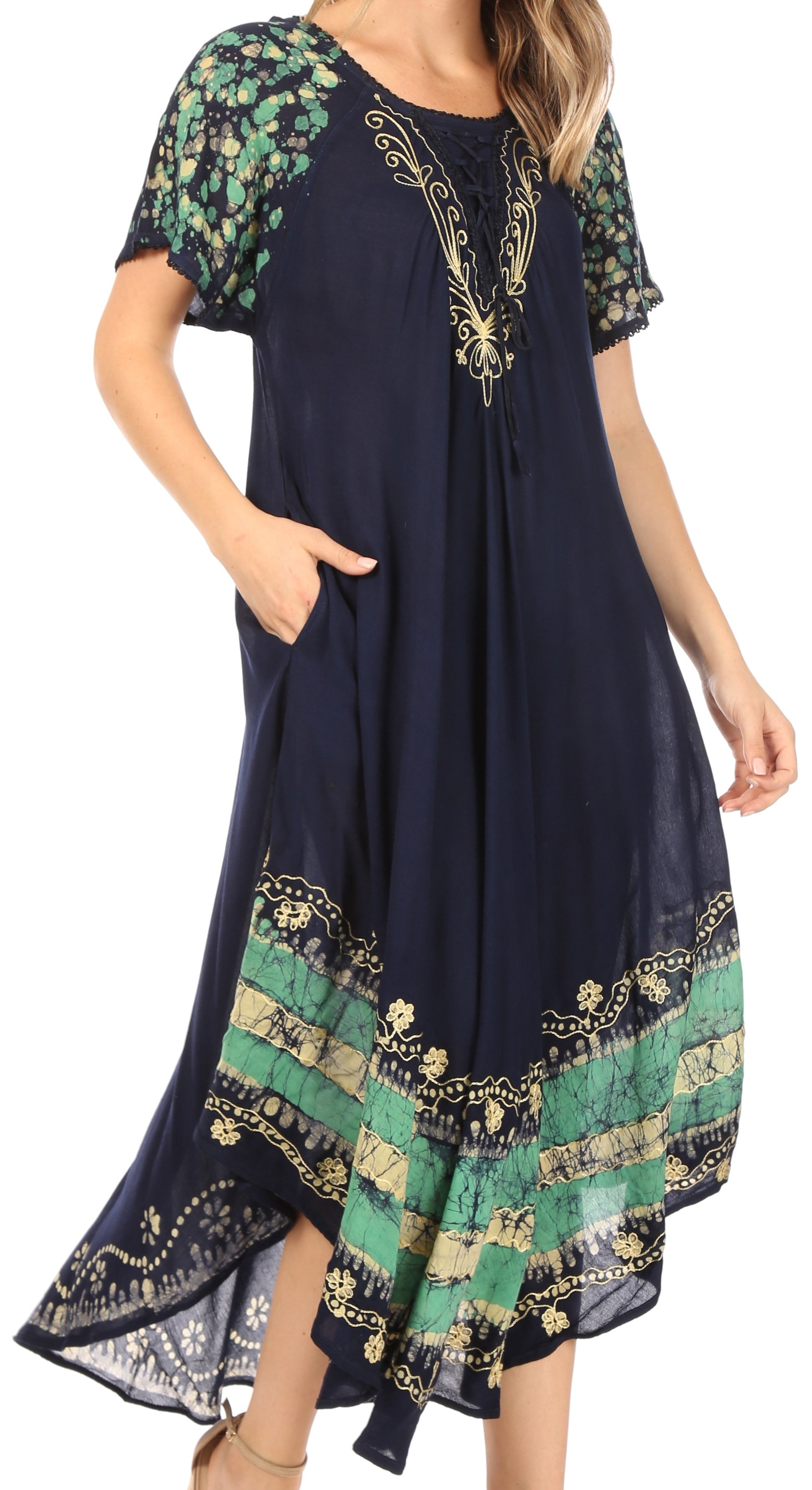 Navy blue dress with green and gold floral patterns on a white background