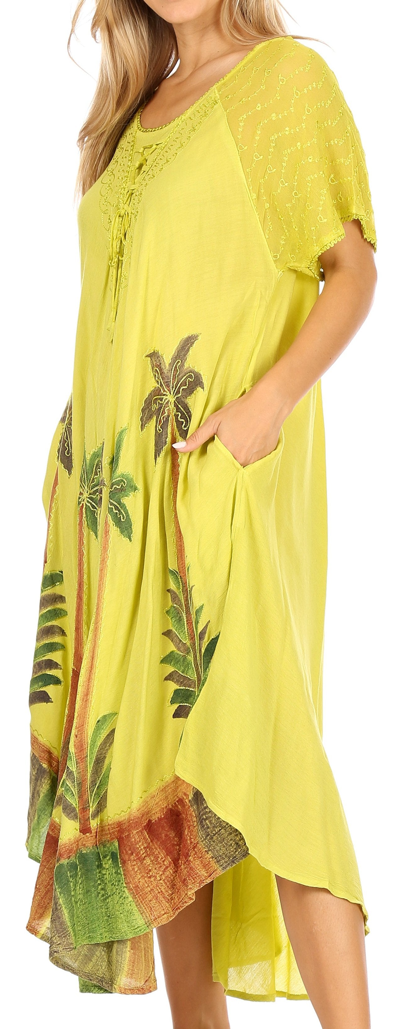 Woman wearing a yellow dress with palm tree patterns