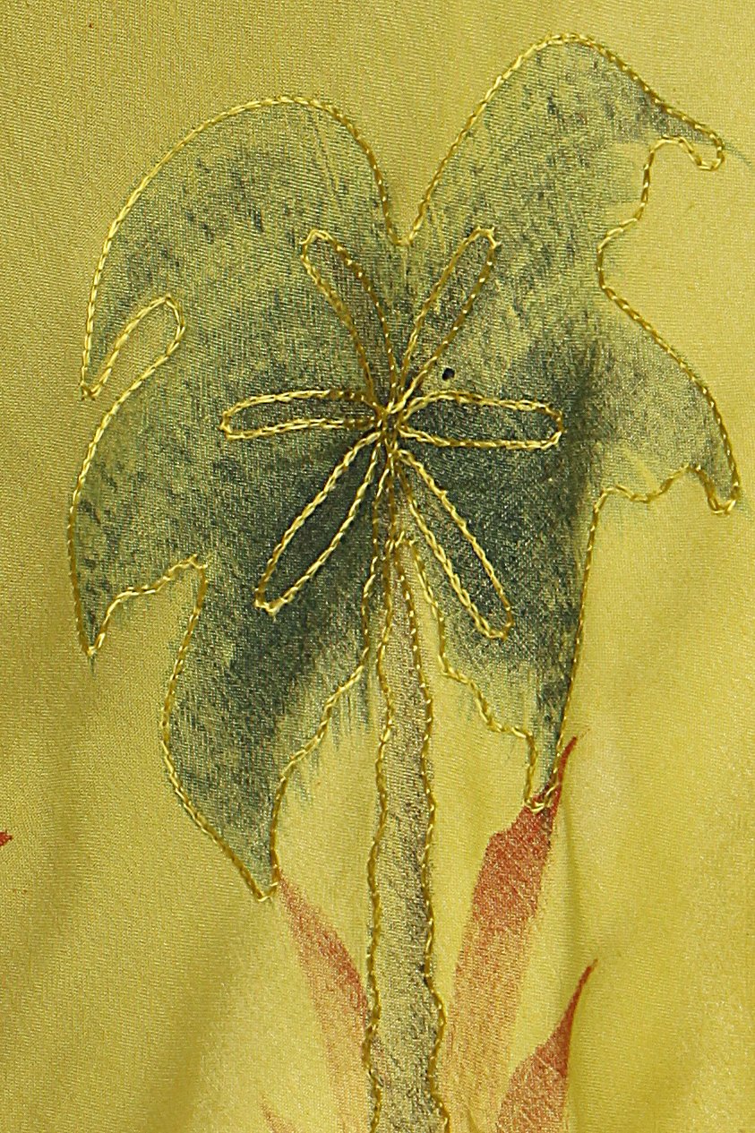 Embroidered leaf design on a fabric background