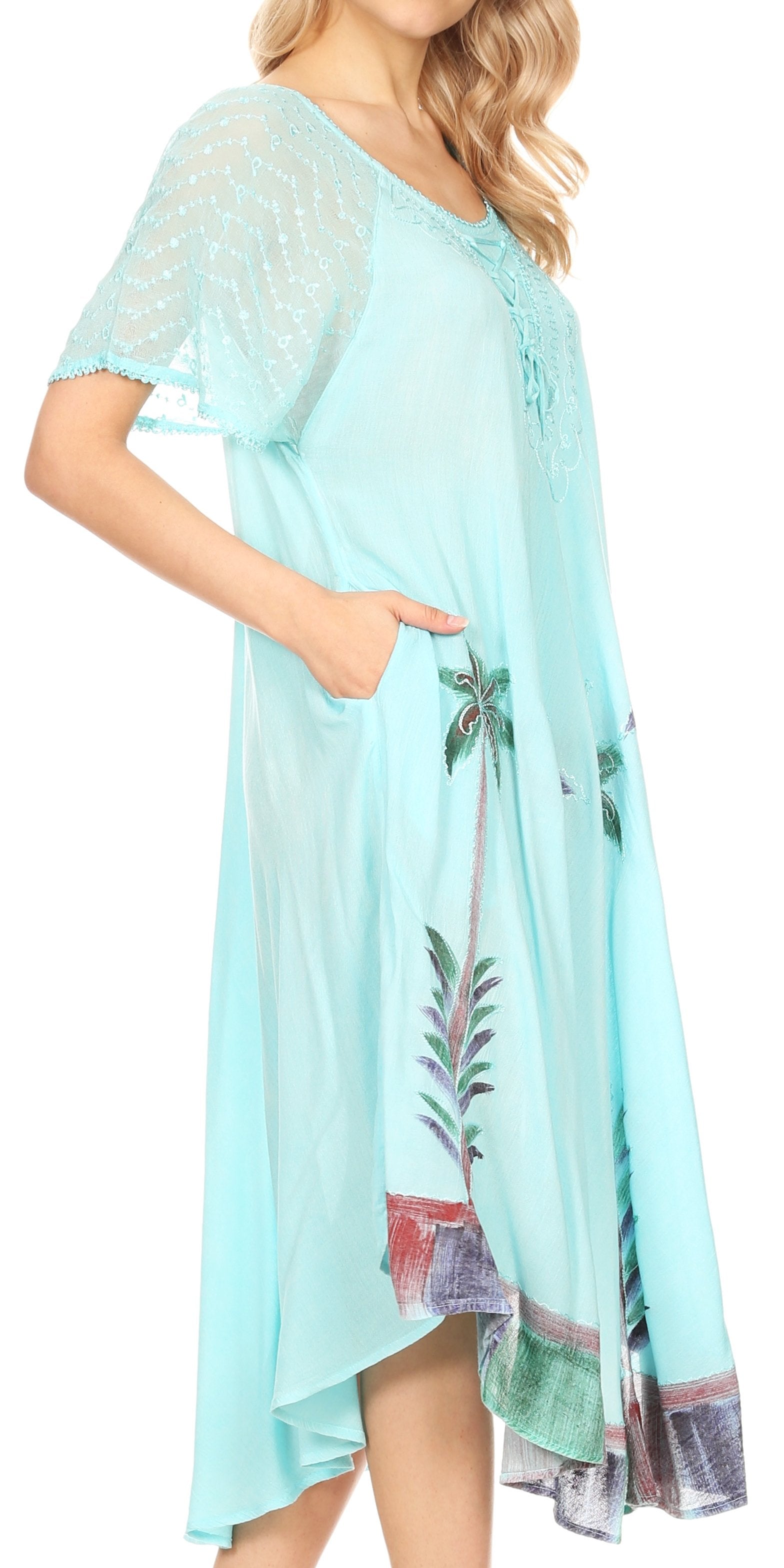 Light blue dress with palm tree design on a white background