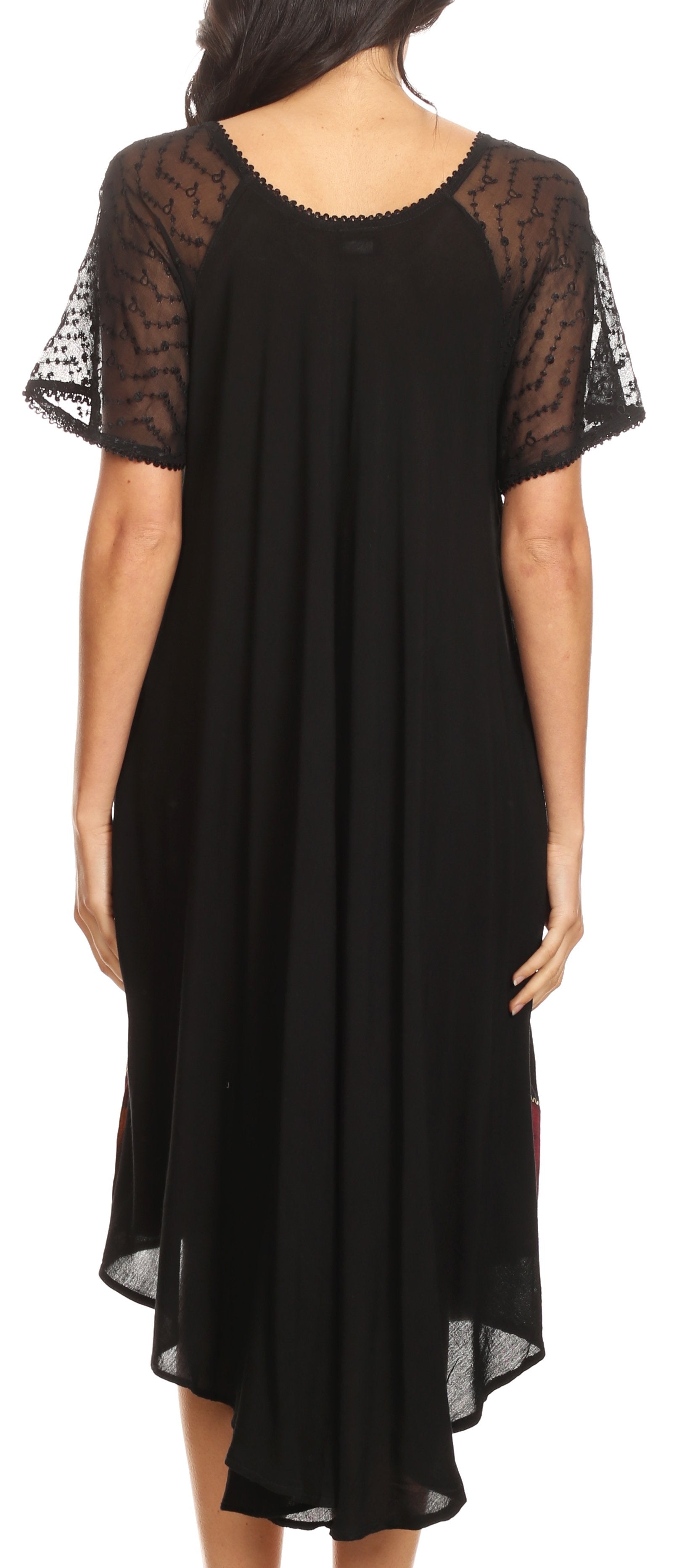 Black dress with sheer sleeves worn by a model on a white background