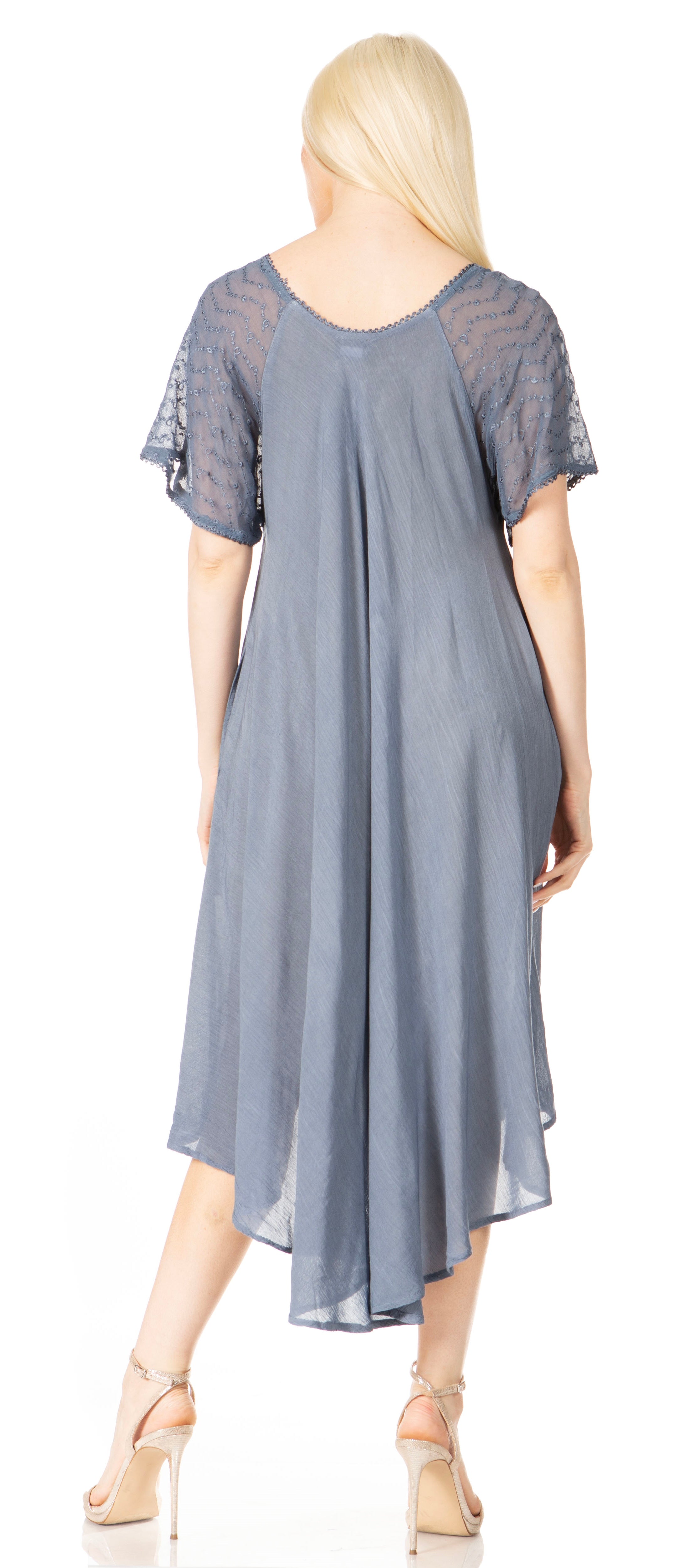 Woman wearing a blue dress with lace sleeves on a white background