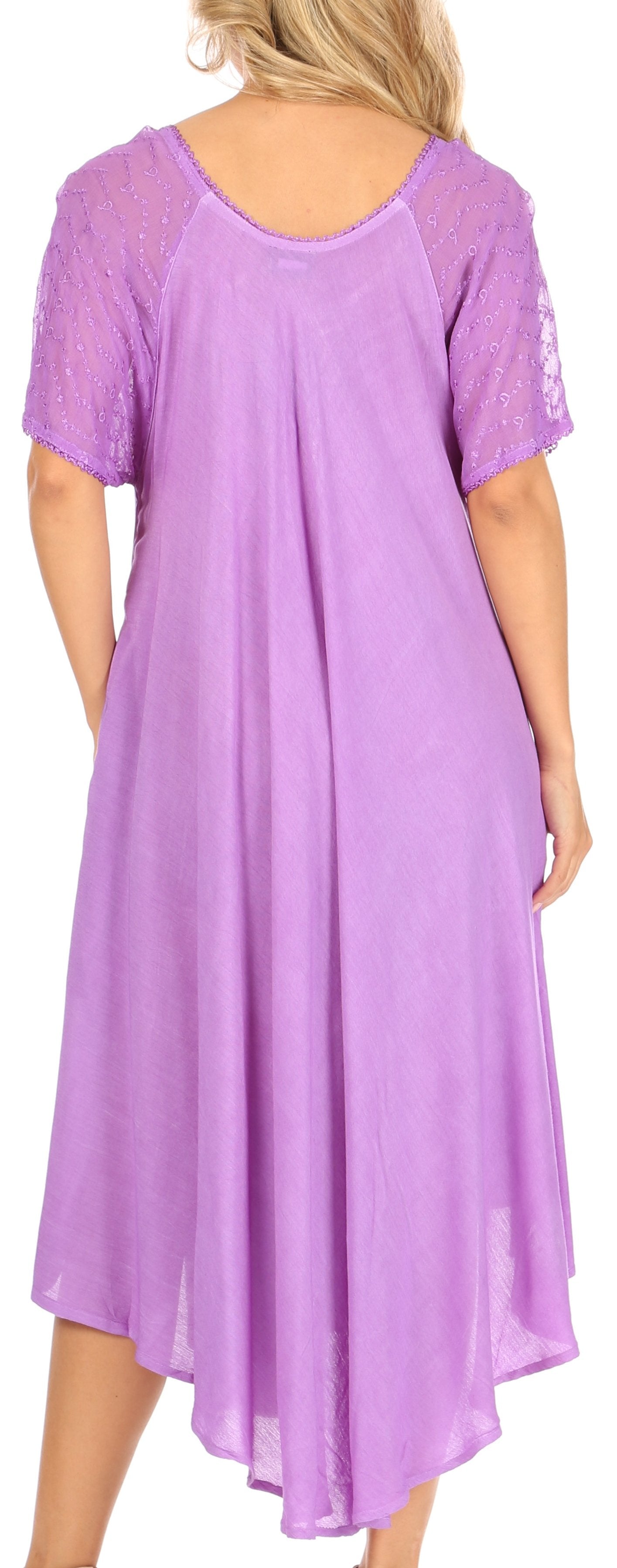 Woman wearing a purple dress with lace sleeves and hem.