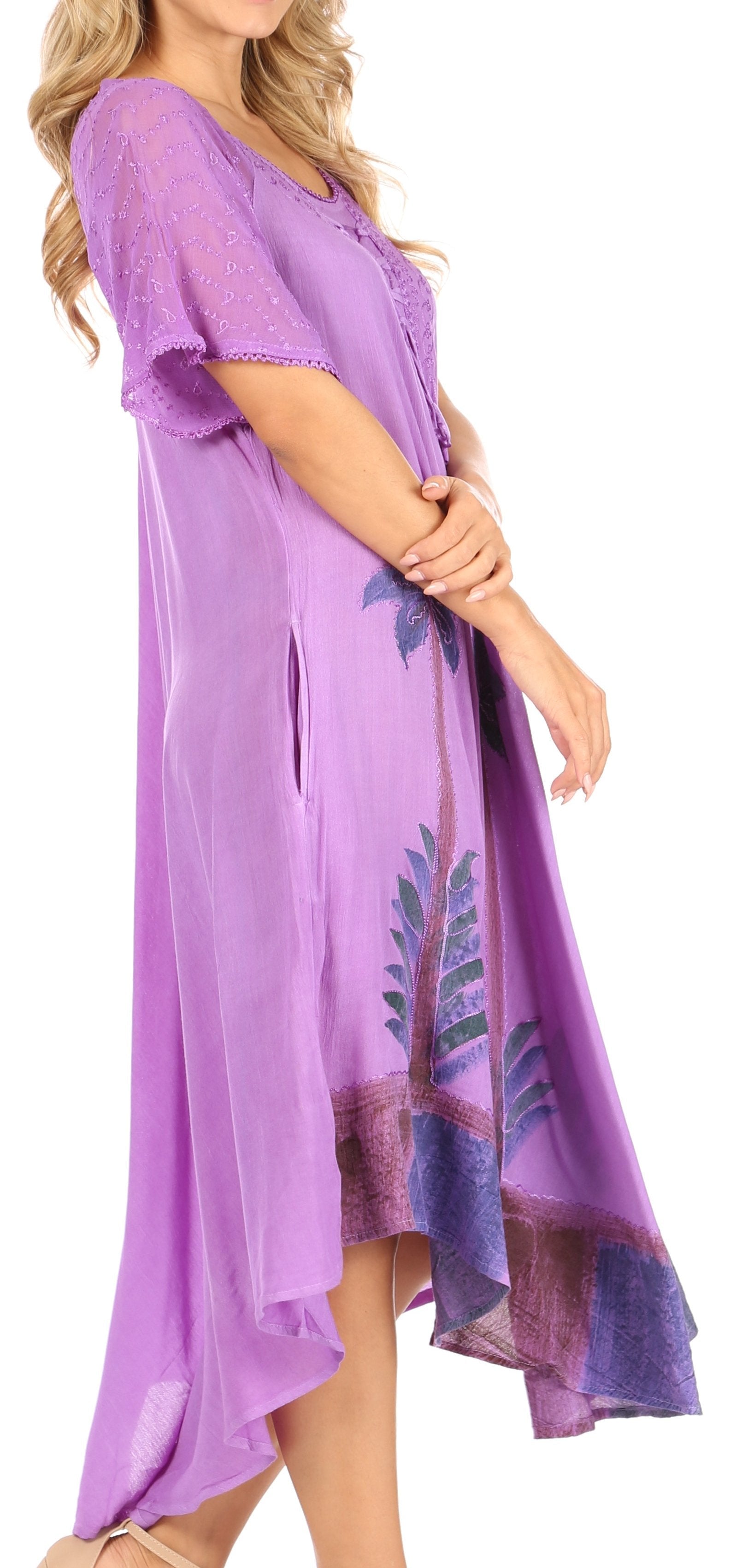 Woman wearing a purple dress with floral patterns on a white background