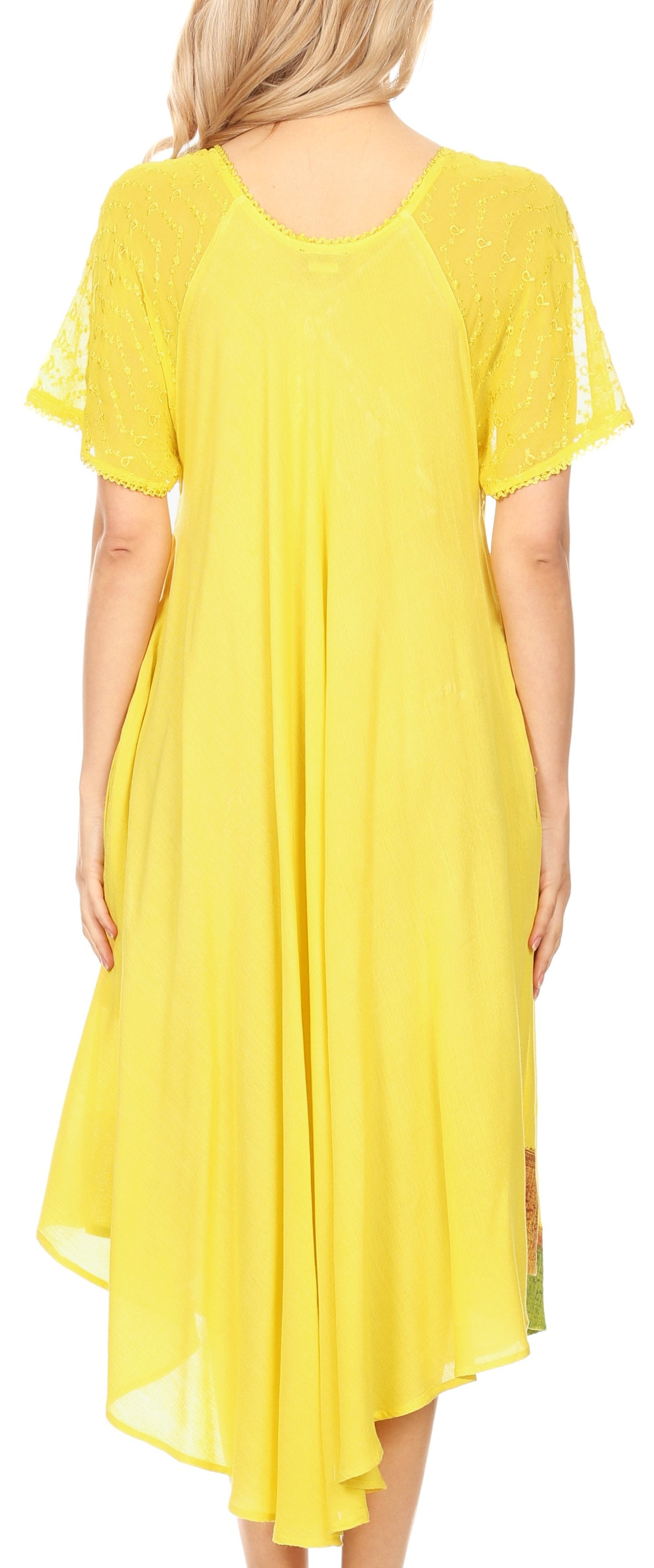 Woman wearing a yellow dress with a plain background