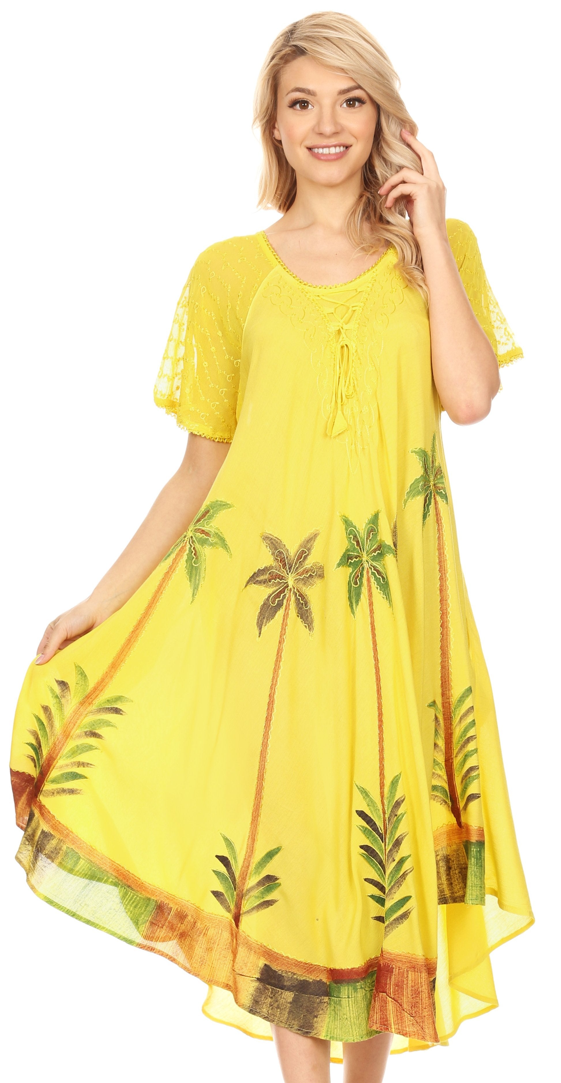 Woman wearing a yellow dress with palm tree patterns on a white background