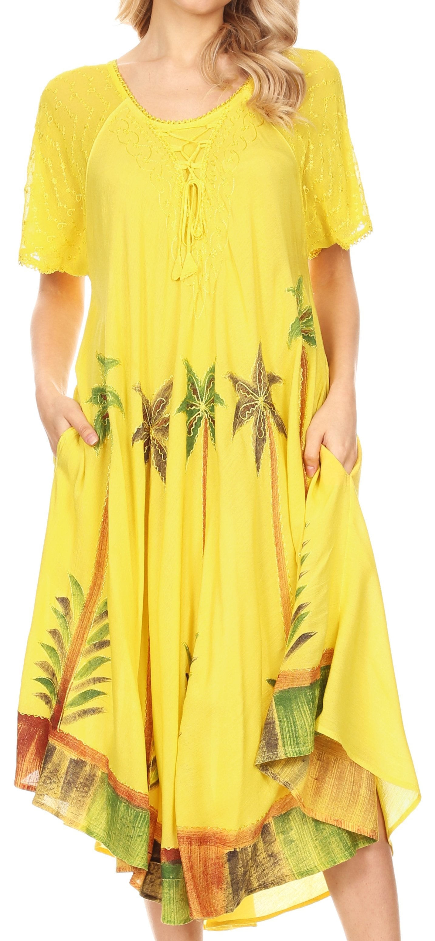 Woman wearing a yellow dress with floral patterns