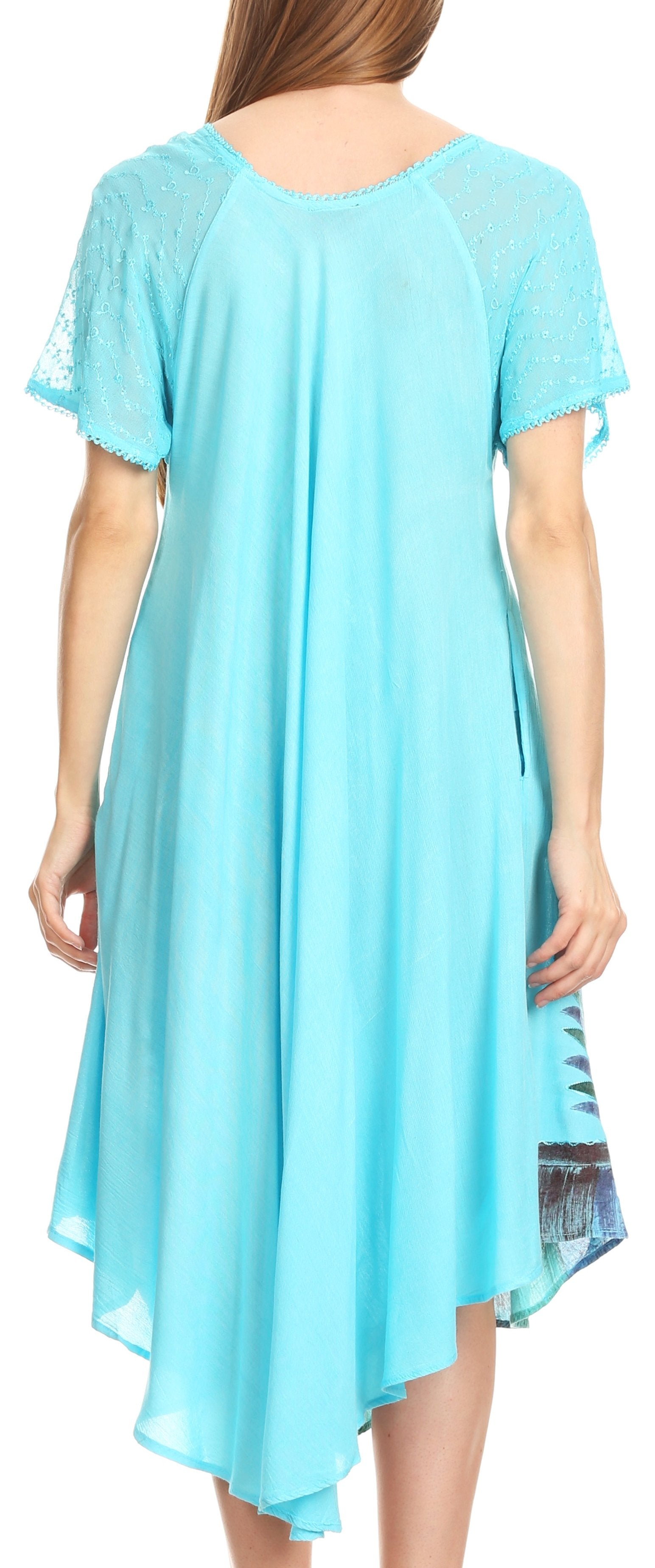 Light blue dress with sheer sleeves and hem, worn by a model.