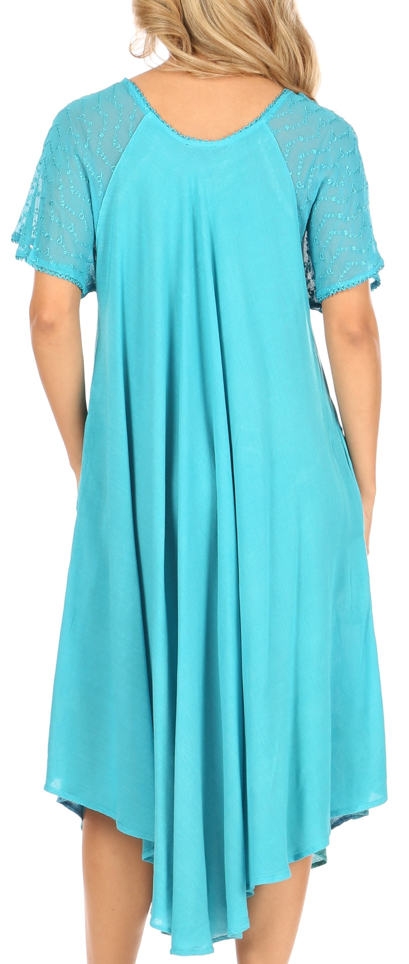 Woman wearing a turquoise dress with lace sleeves