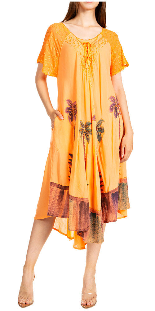 Woman wearing an orange dress with floral patterns on a white background