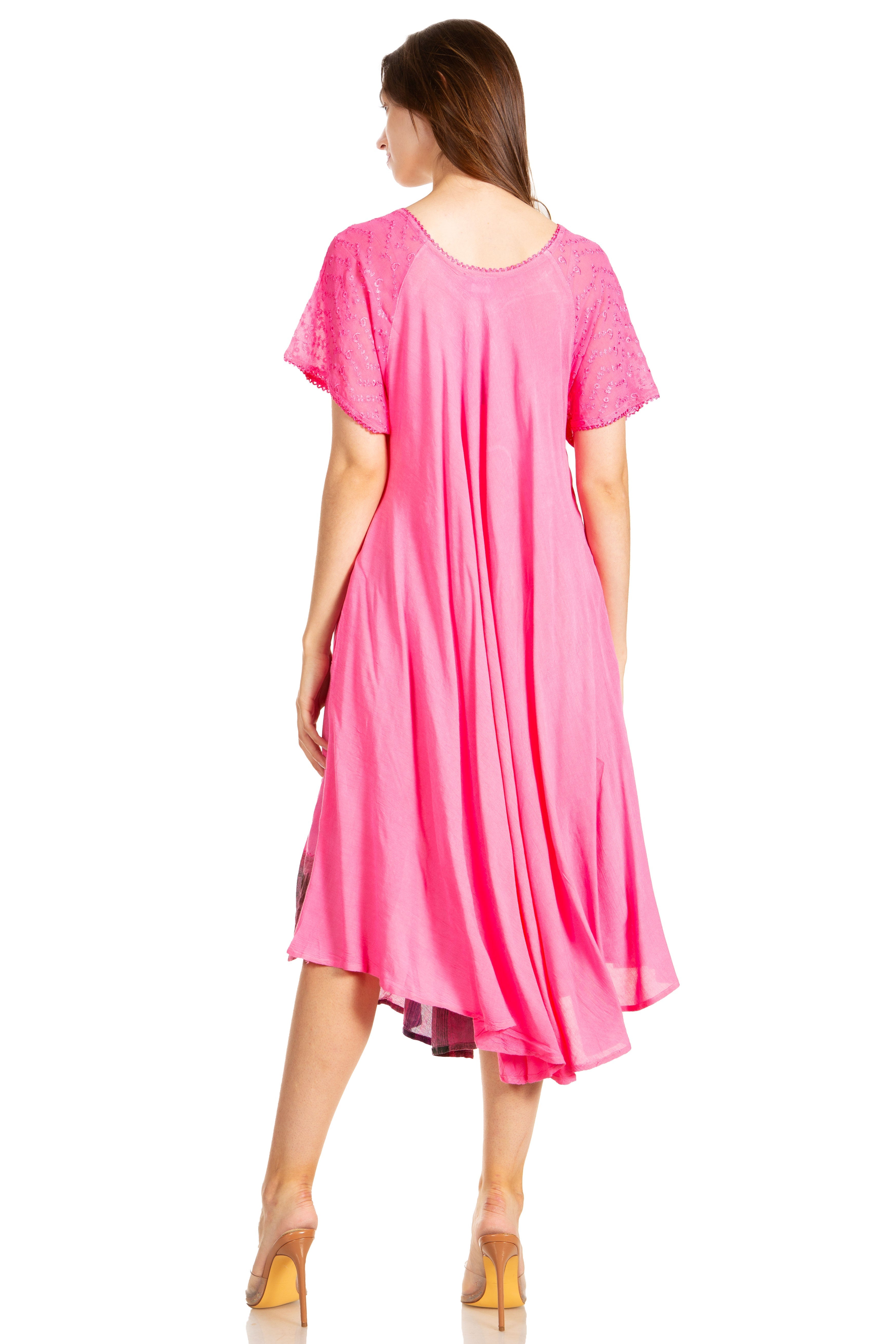 Woman wearing a pink dress on a white background