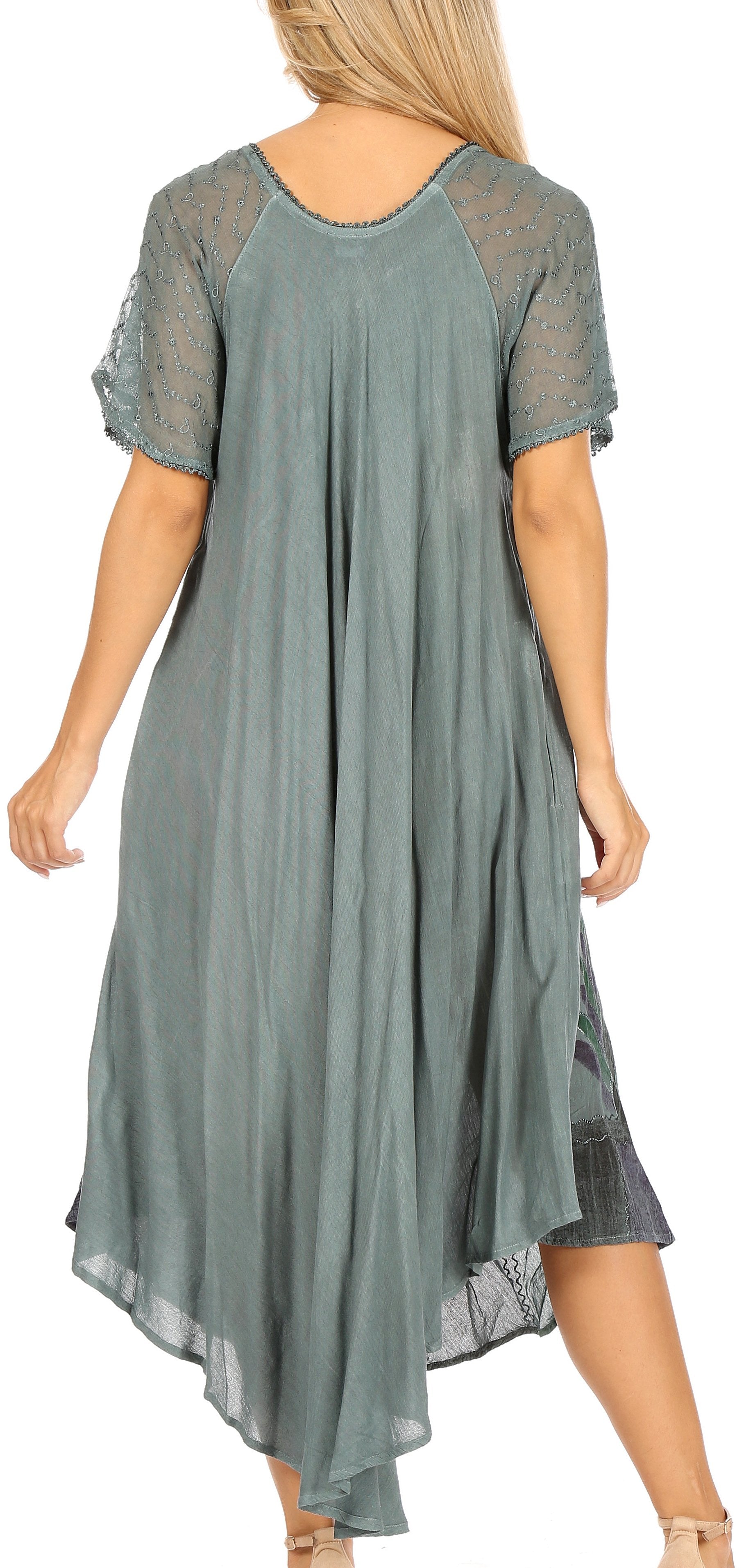 Woman wearing a green dress with mesh sleeves on a white background