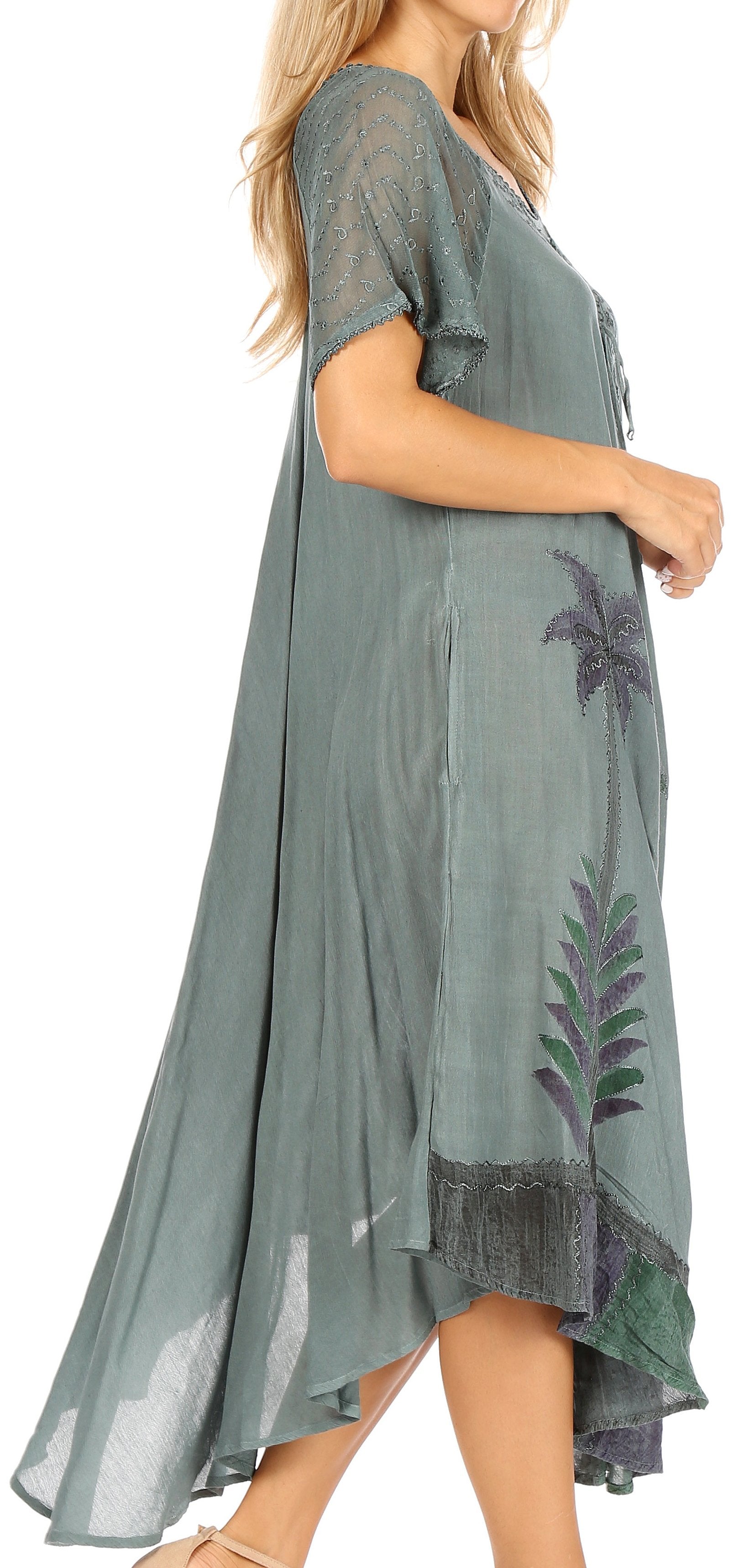 Green dress with floral embroidery on a white background