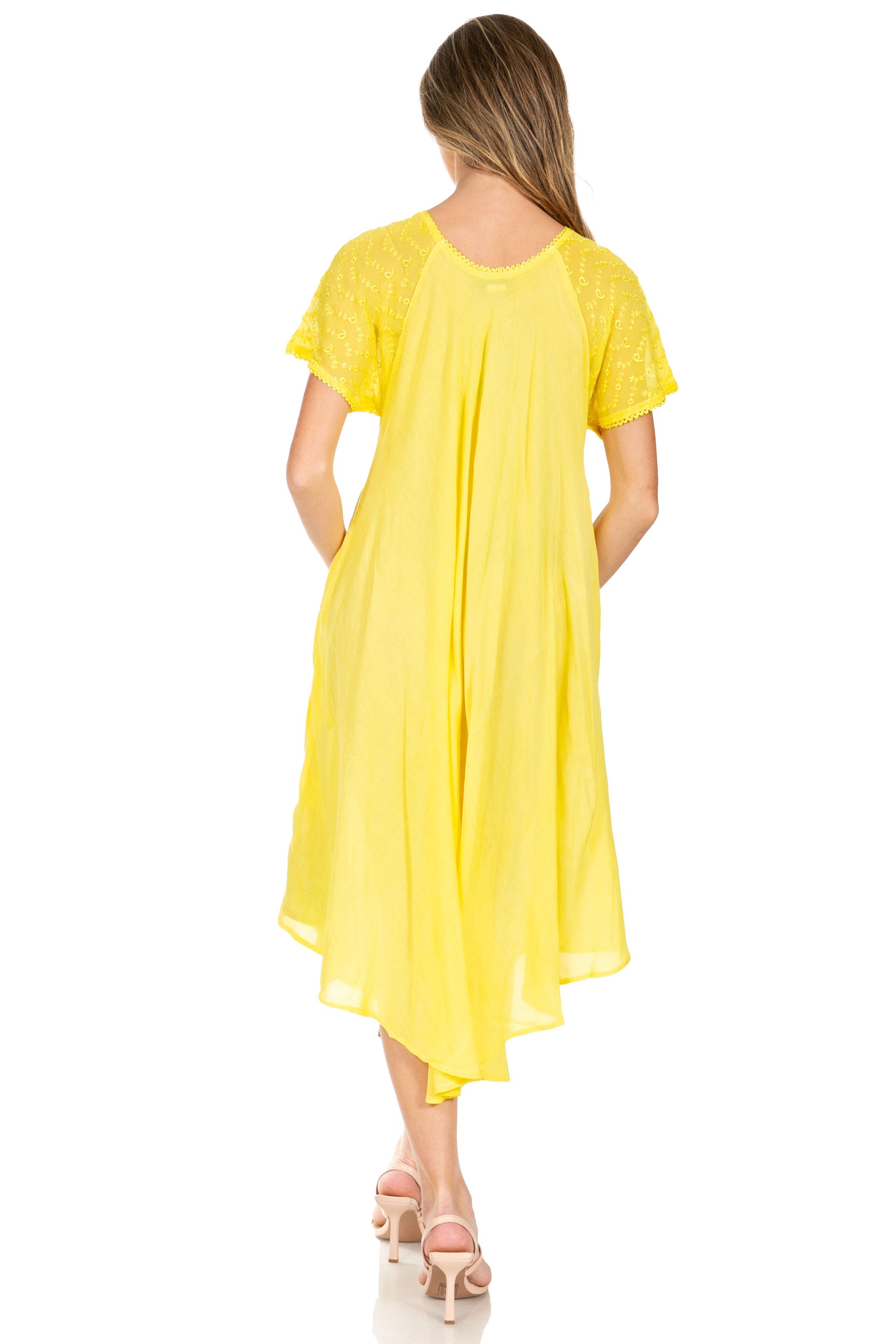Woman wearing a yellow dress on a white background