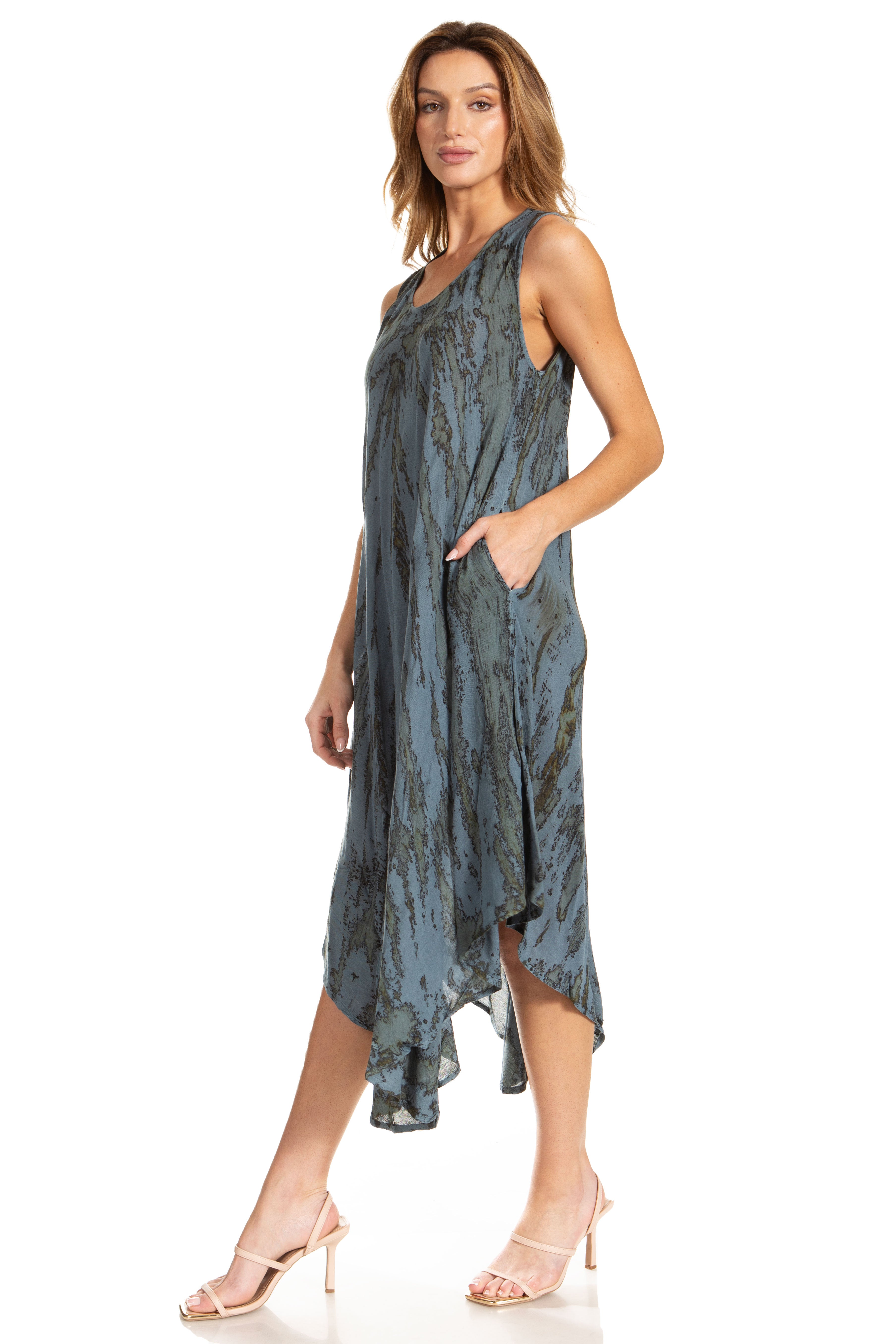 Woman wearing a blue patterned dress on a white background