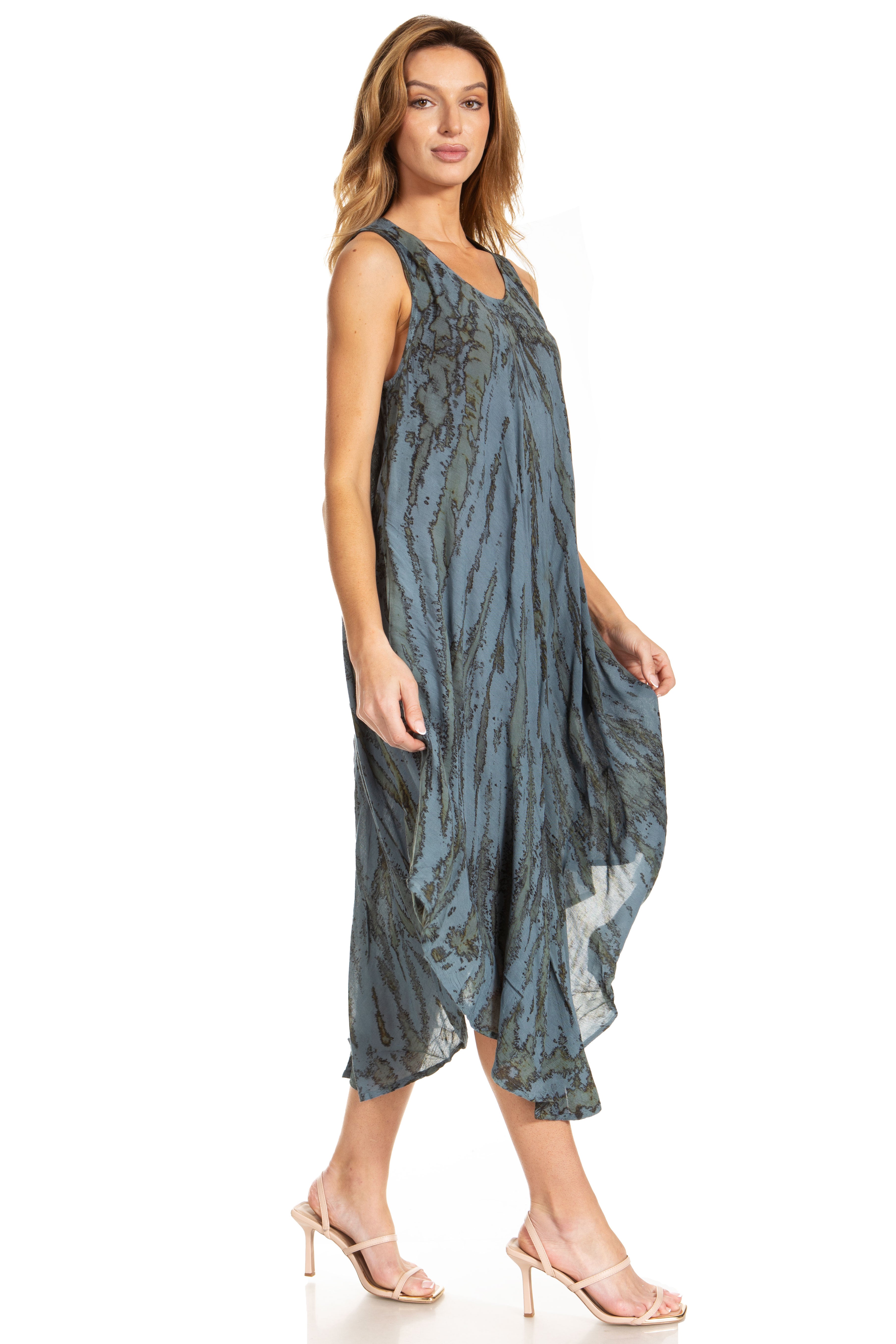 Woman wearing a blue patterned dress on a white background