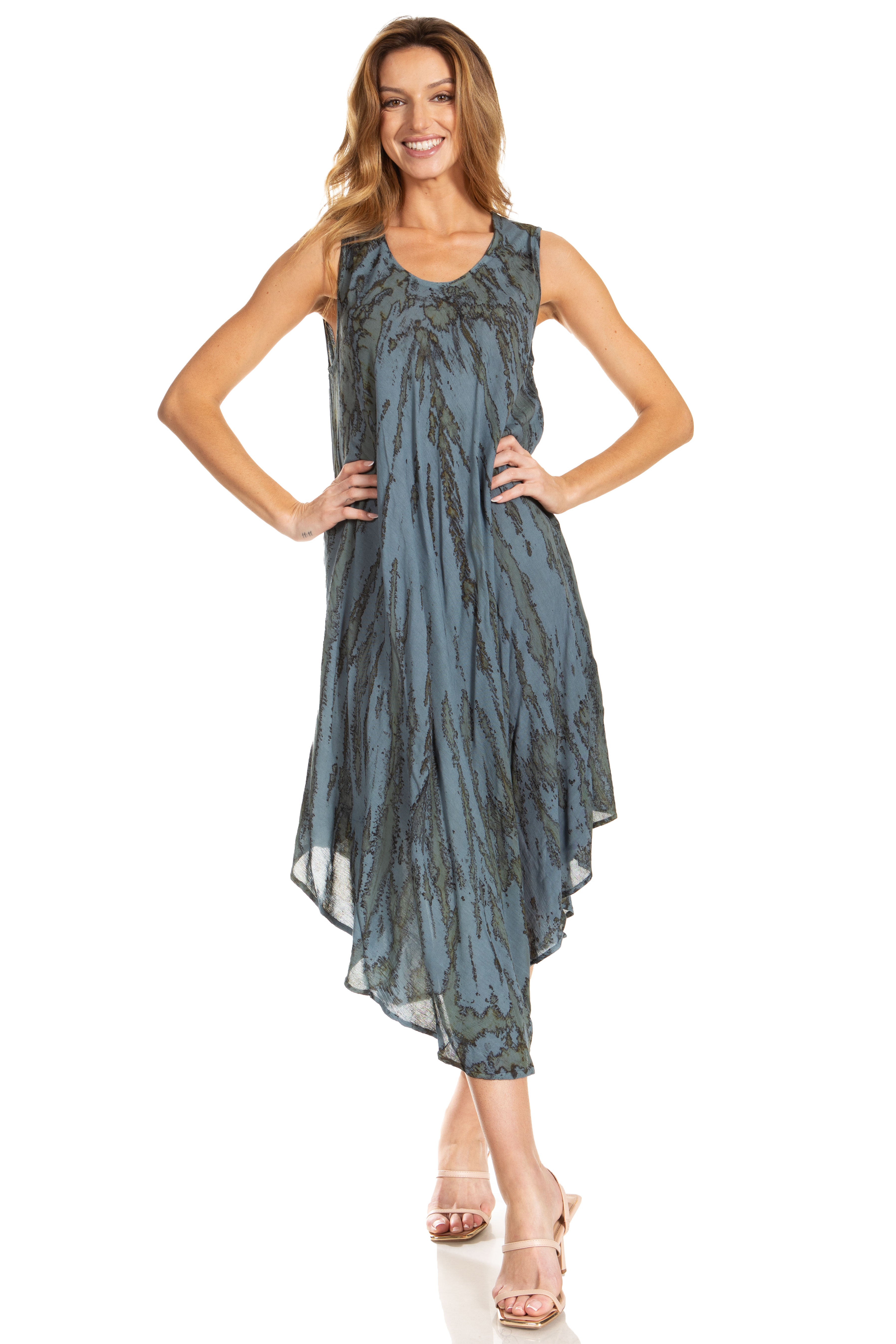 Woman wearing a sleeveless, patterned dress on a white background