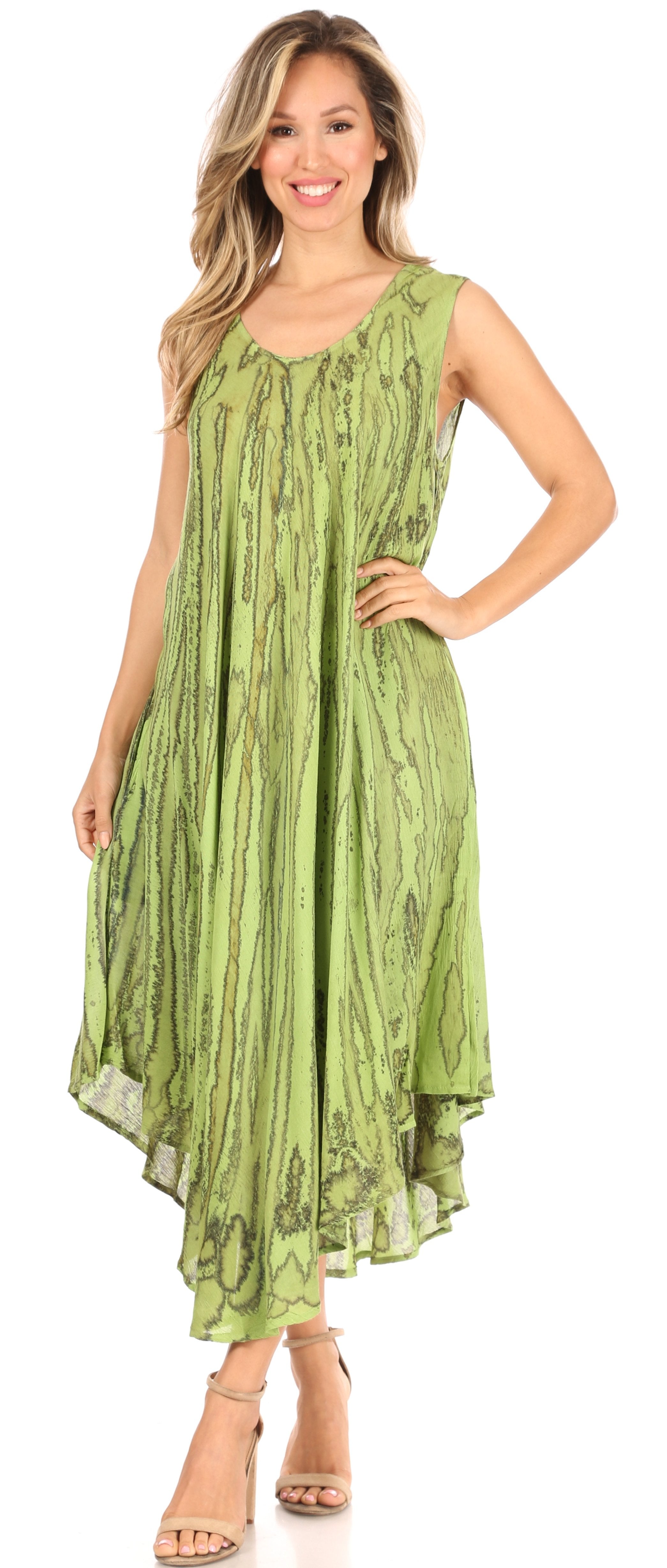 Woman wearing a green patterned dress on a white background