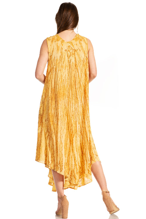 Woman wearing a yellow tie-dye dress on a white background