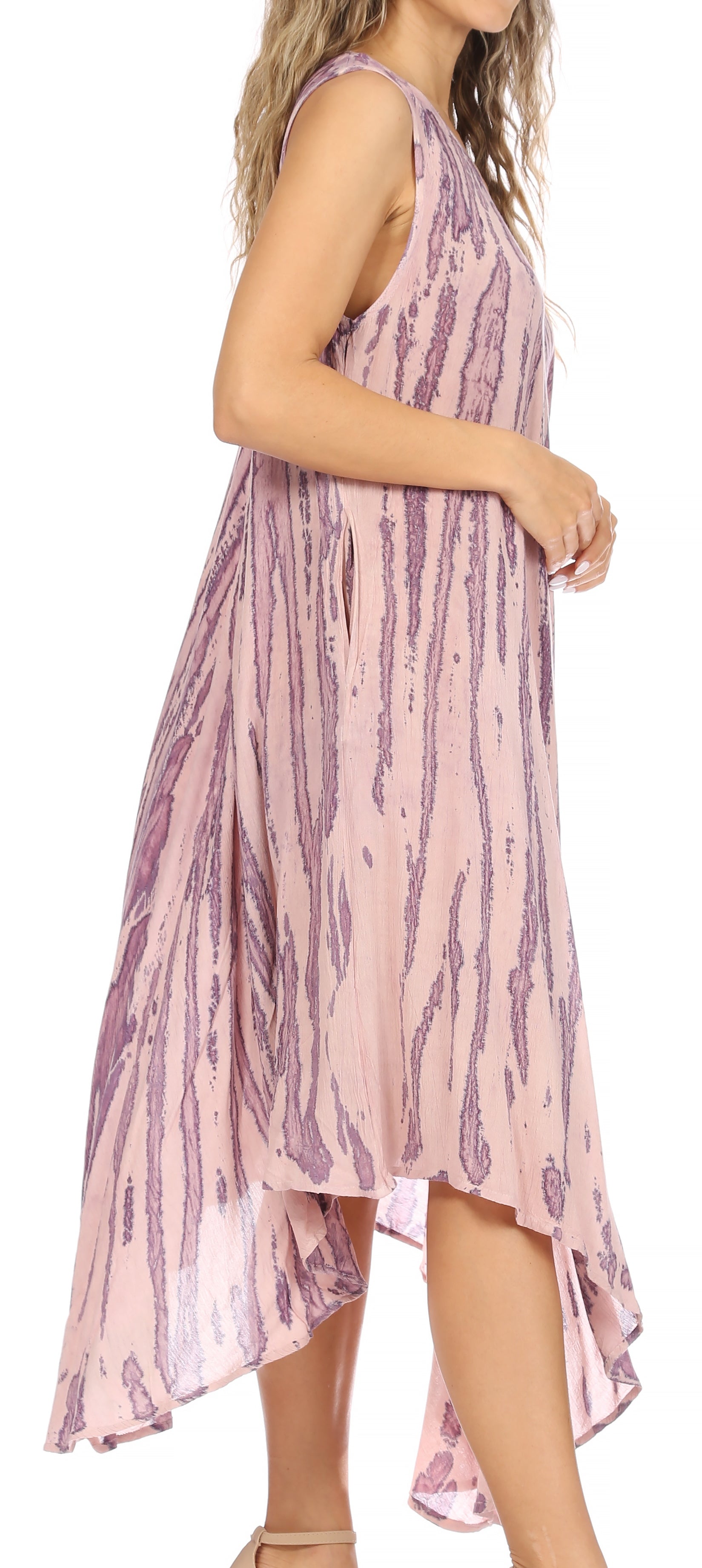 Woman wearing a pink and purple patterned dress on a white background