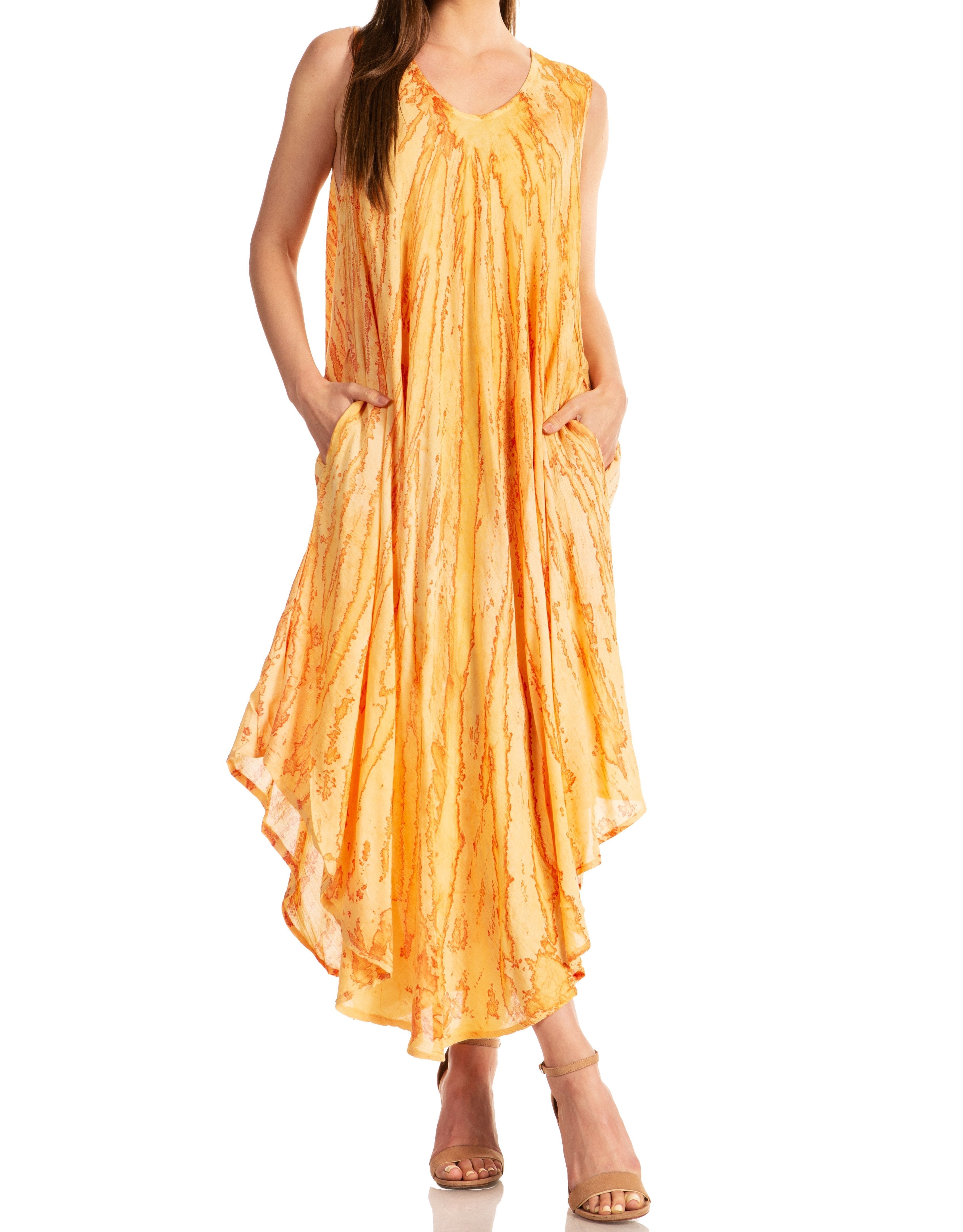 Woman wearing a sleeveless orange dress on a white background