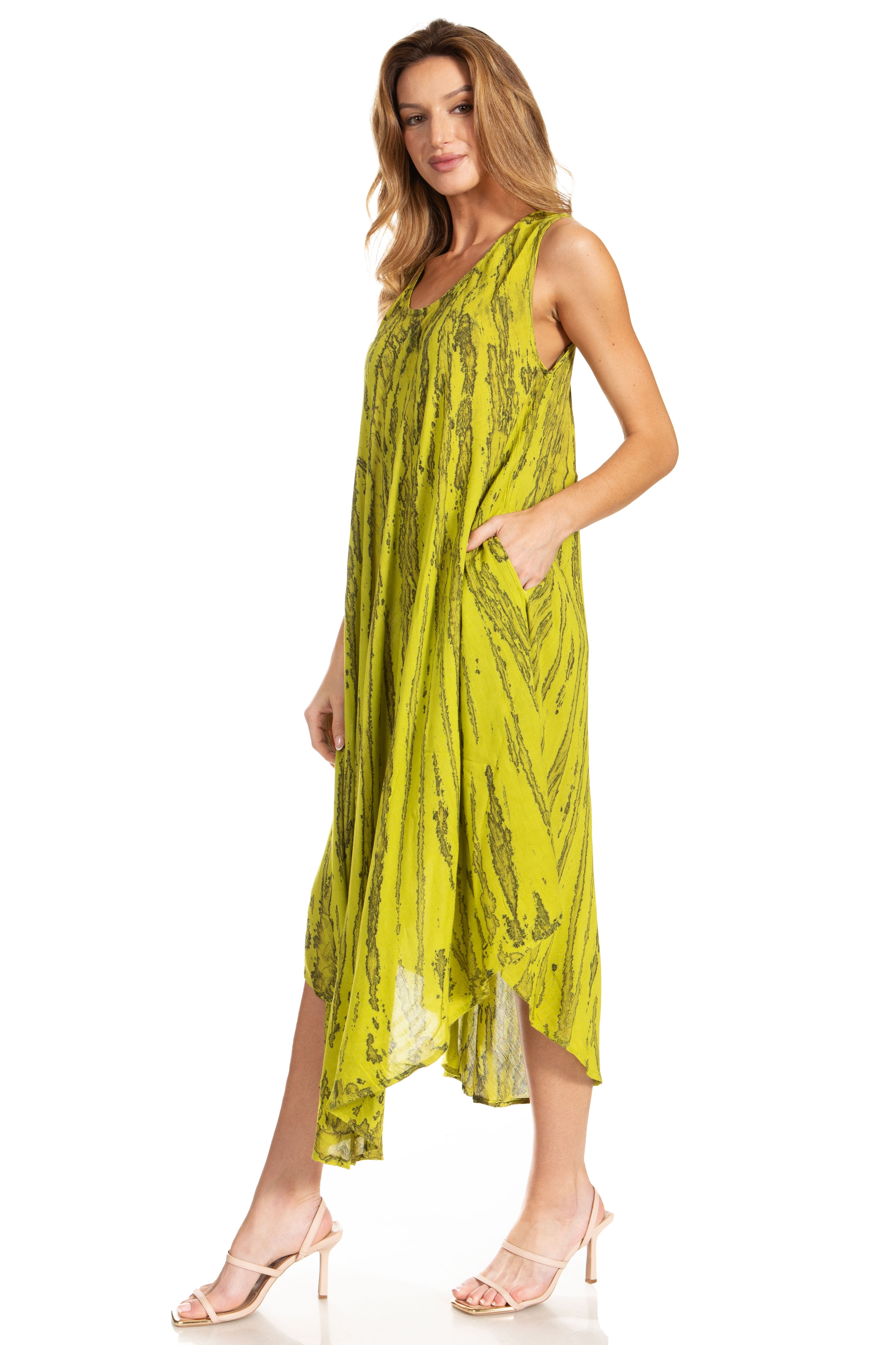 Woman wearing a yellow patterned dress on a white background