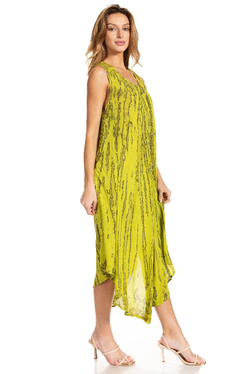 Woman wearing a yellow dress with a subtle pattern on a white background