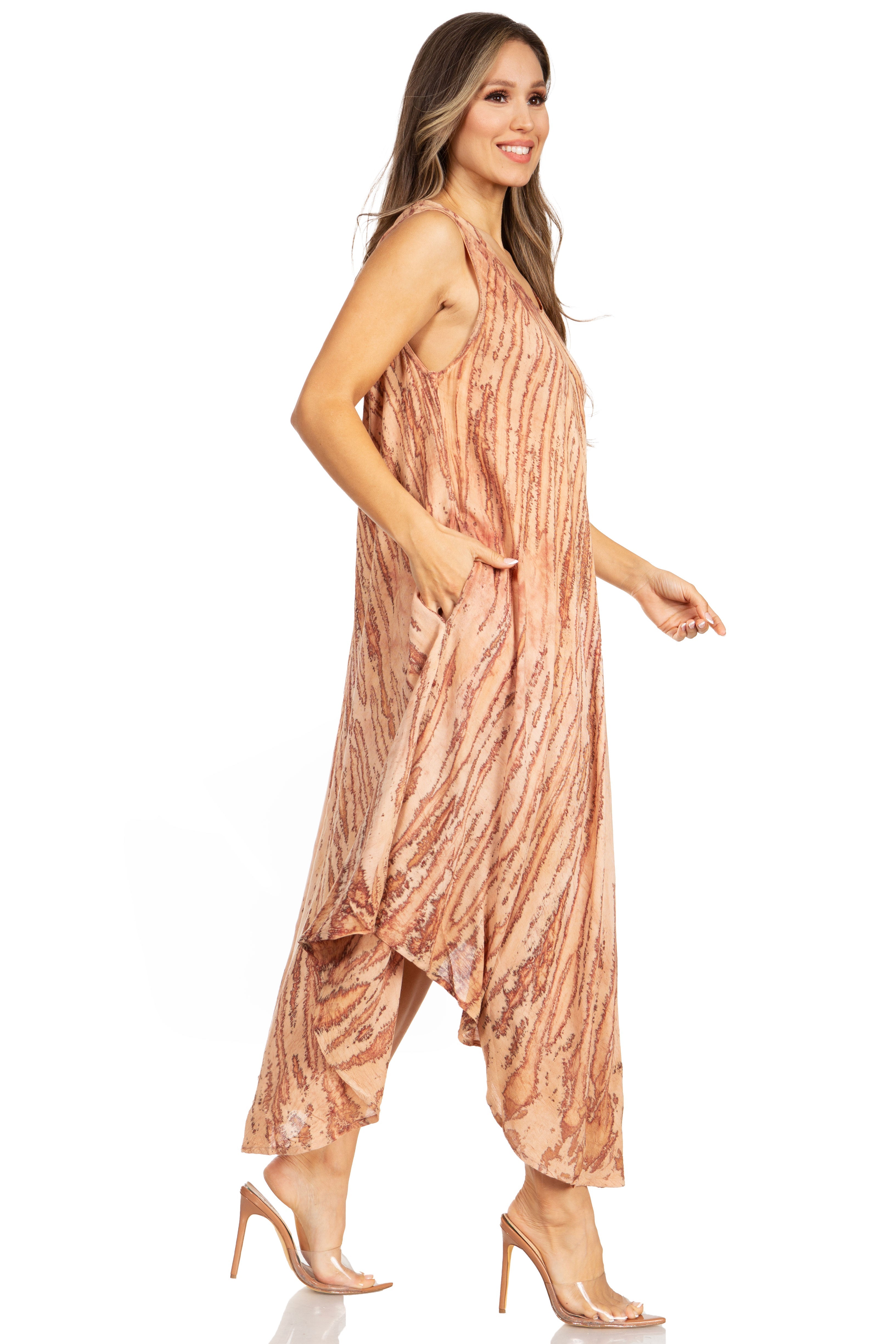 Woman wearing a patterned jumpsuit on a white background