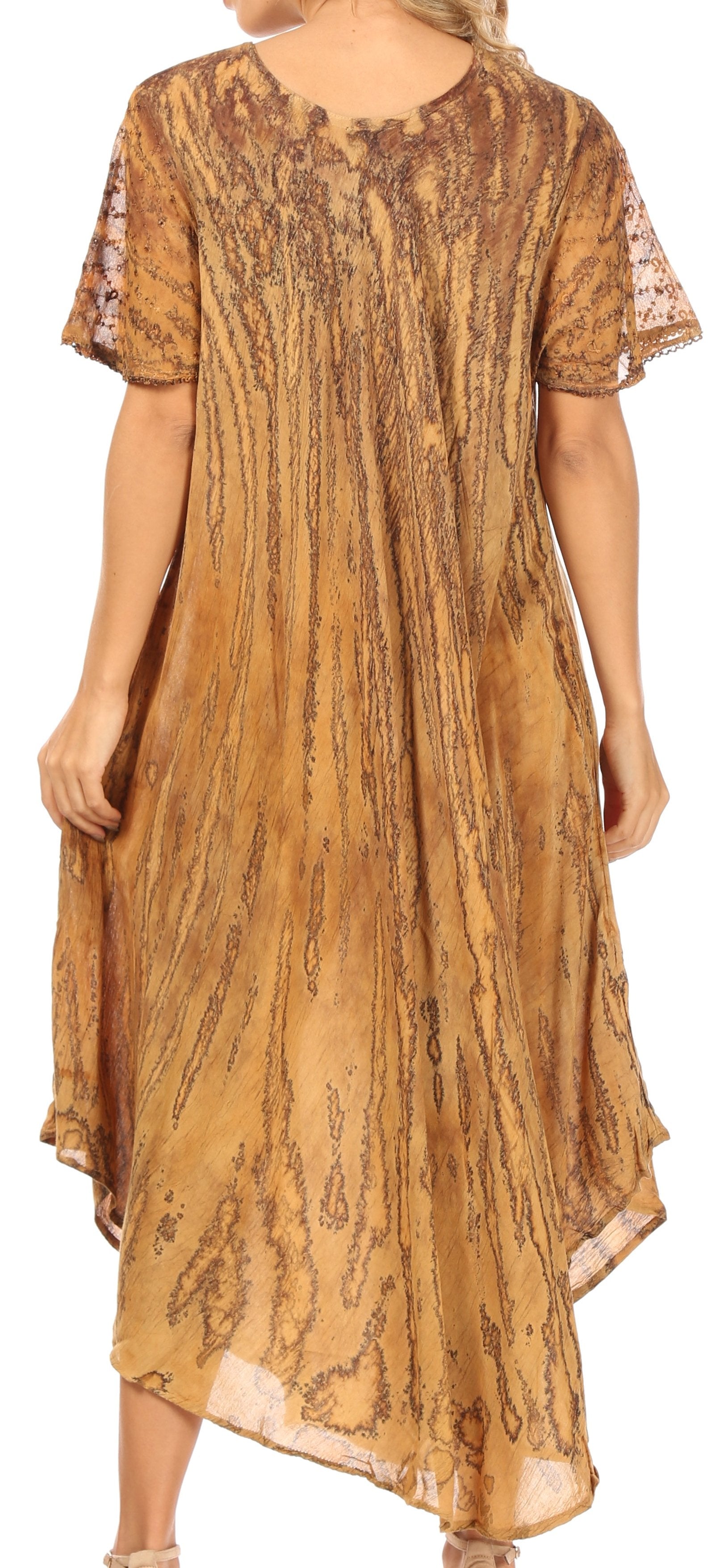 Long, patterned dress in a warm color on a plain background