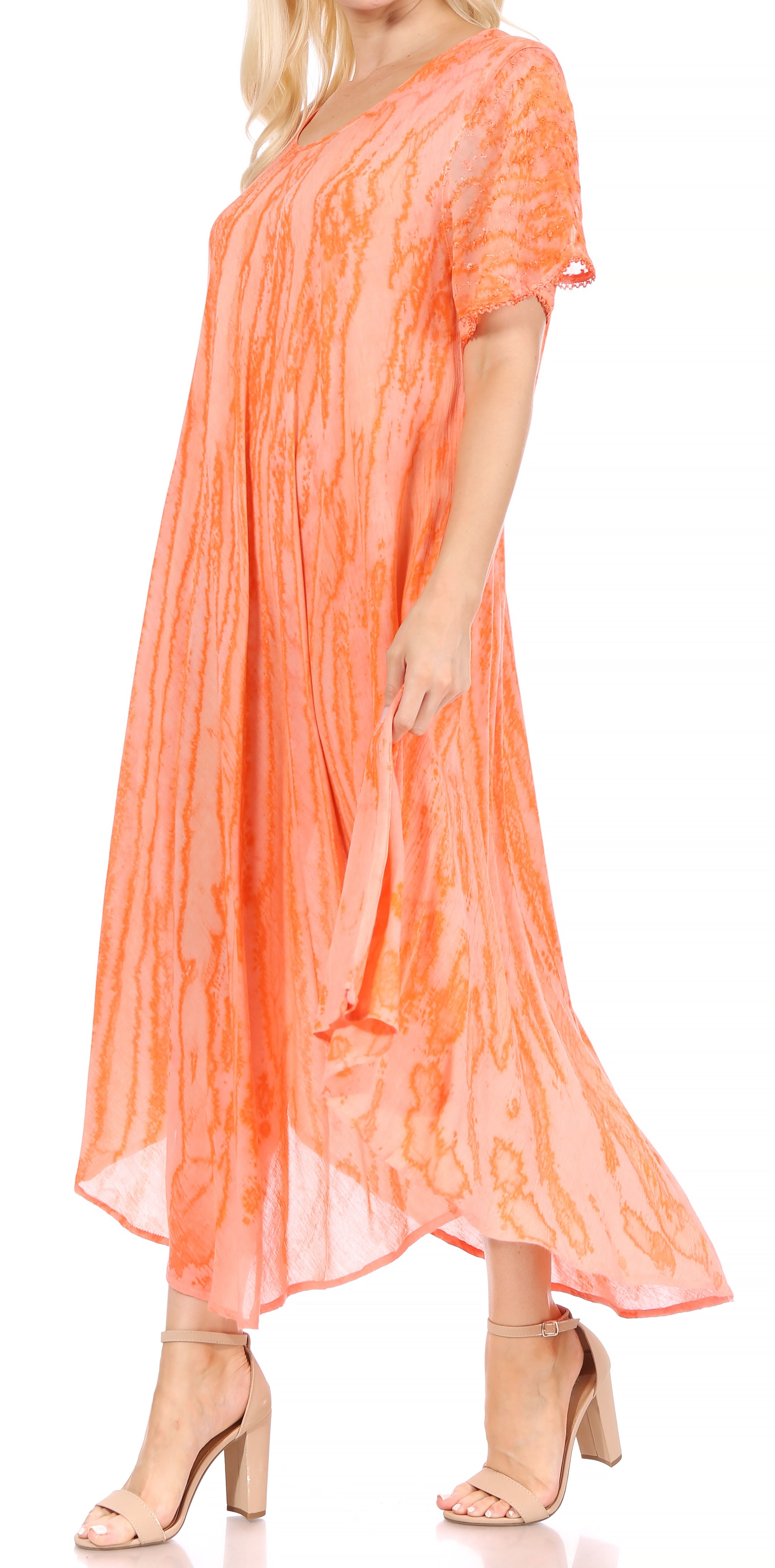 Woman wearing an orange dress with a white background