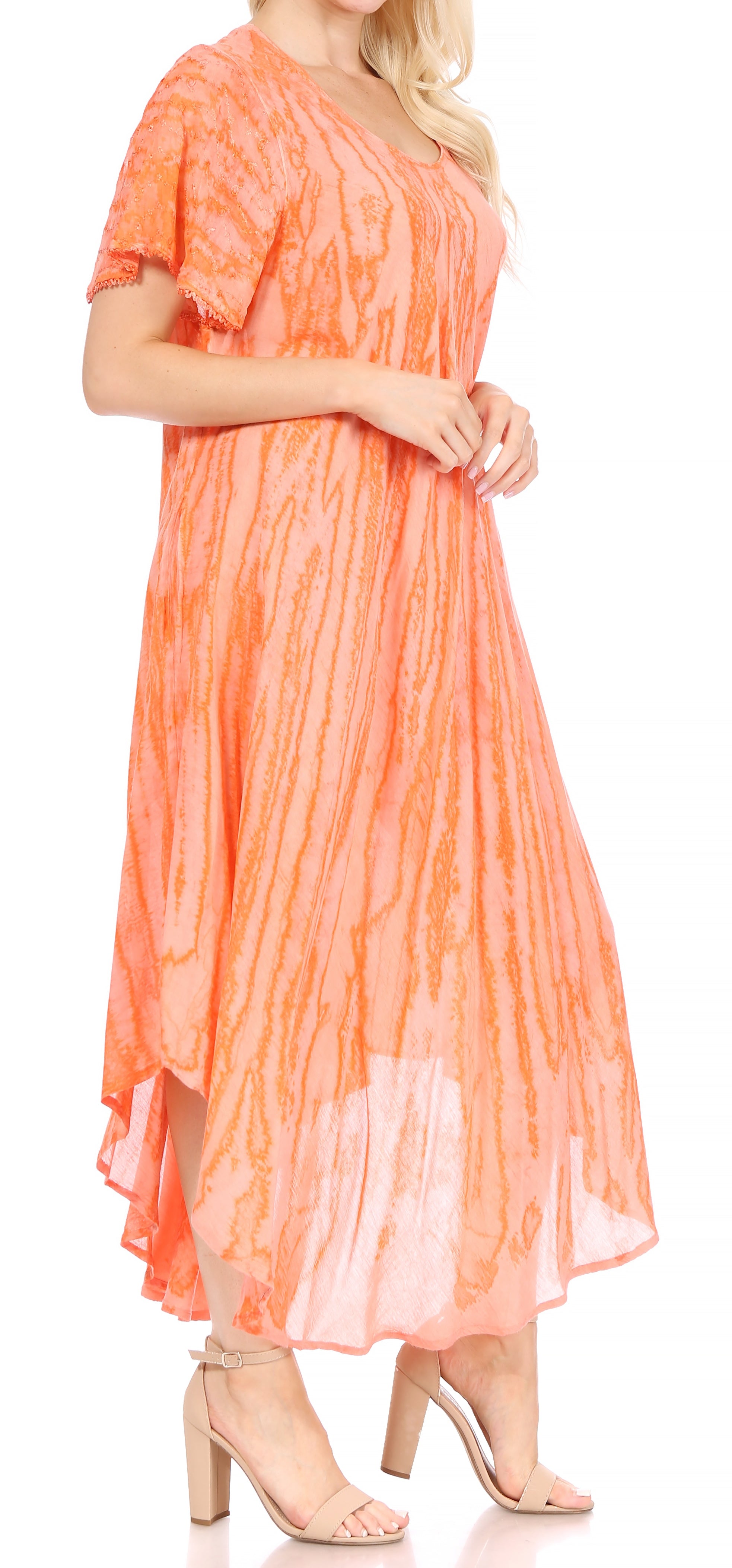 Woman wearing an orange tie-dye dress on a white background