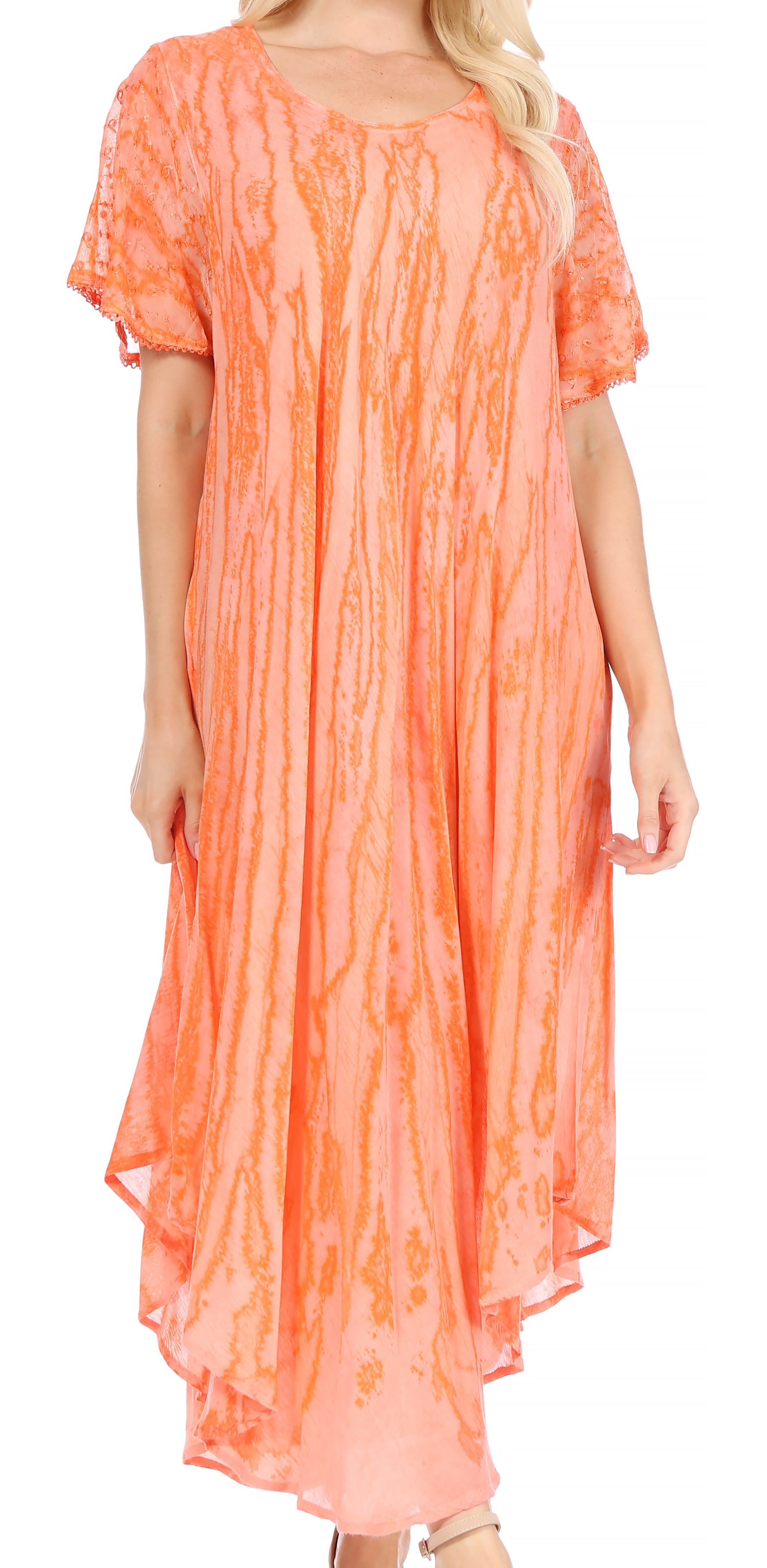 Woman wearing a long orange dress with a white background