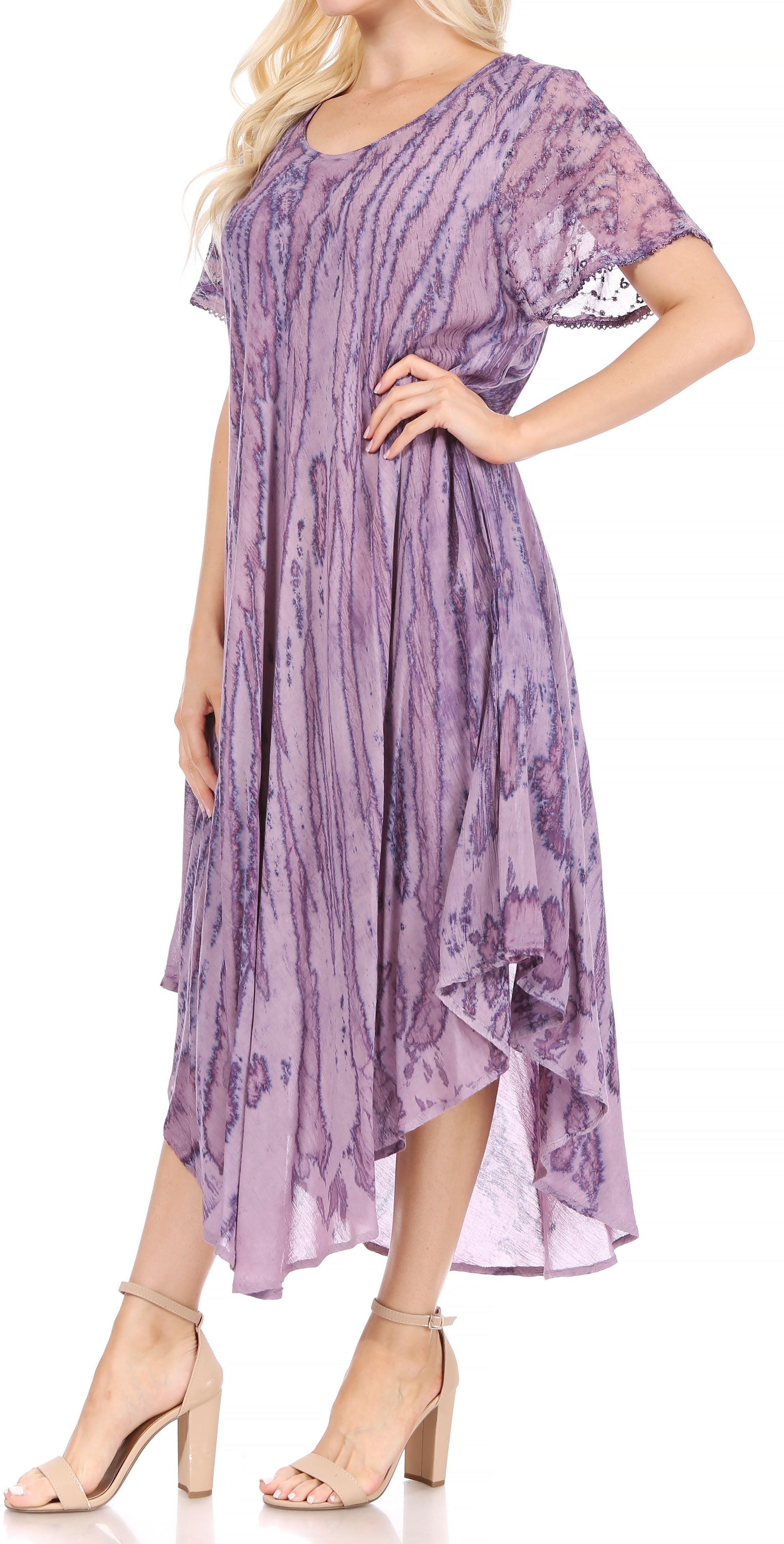 Woman wearing a purple floral dress on a white background