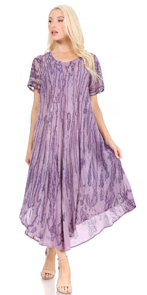 Woman wearing a purple patterned dress on a white background