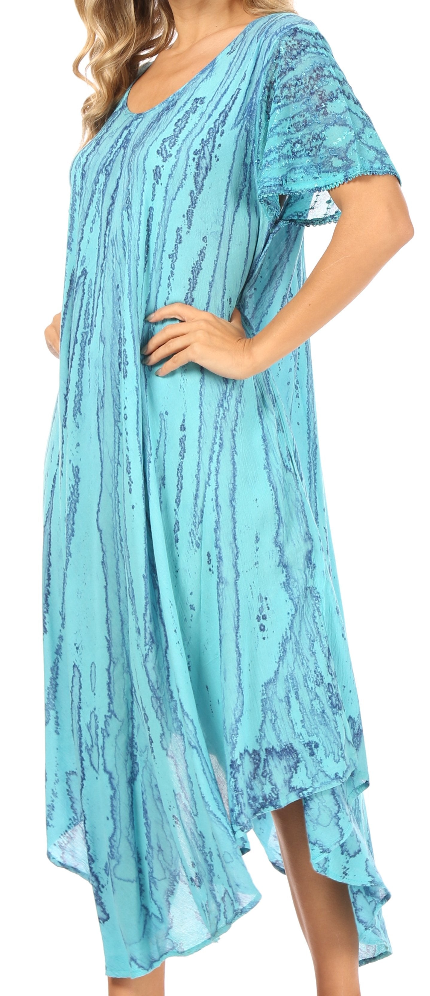 Woman wearing a light blue patterned dress with short sleeves.