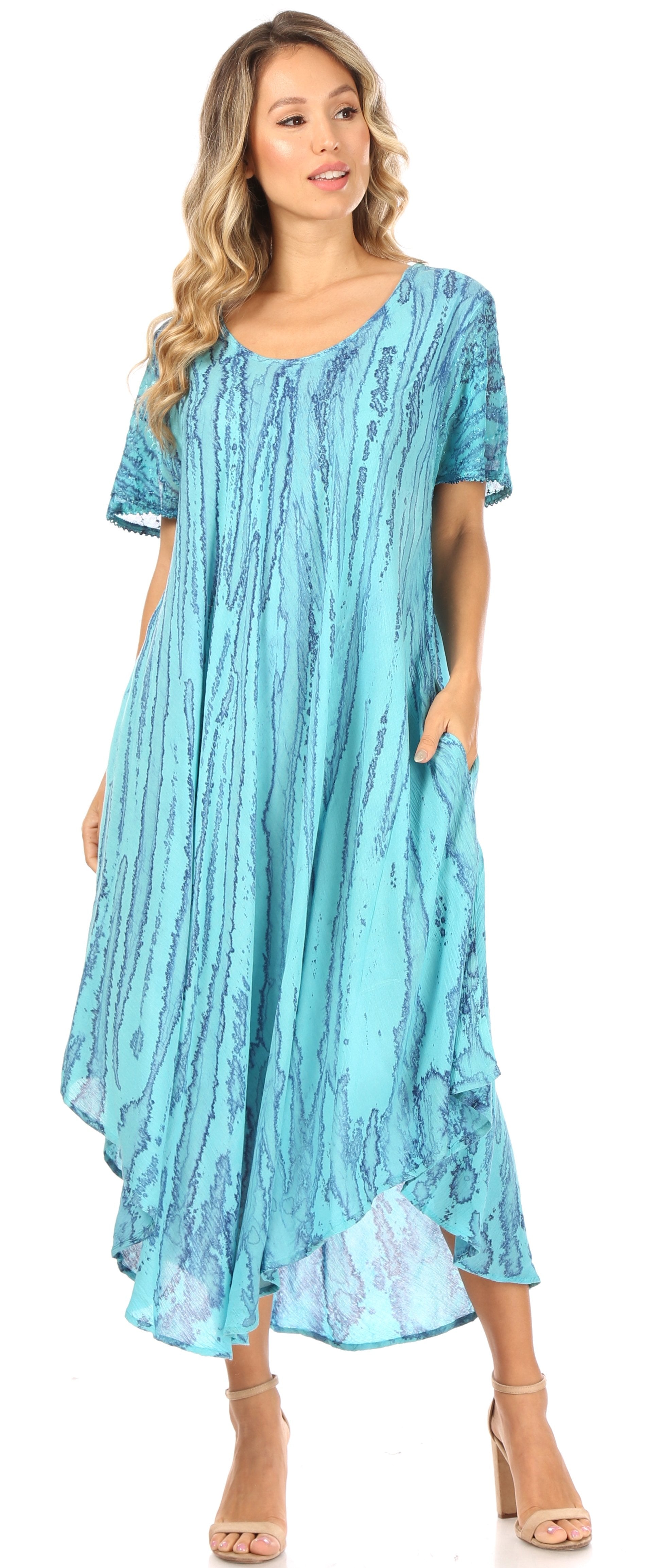 Woman wearing a blue patterned dress on a white background