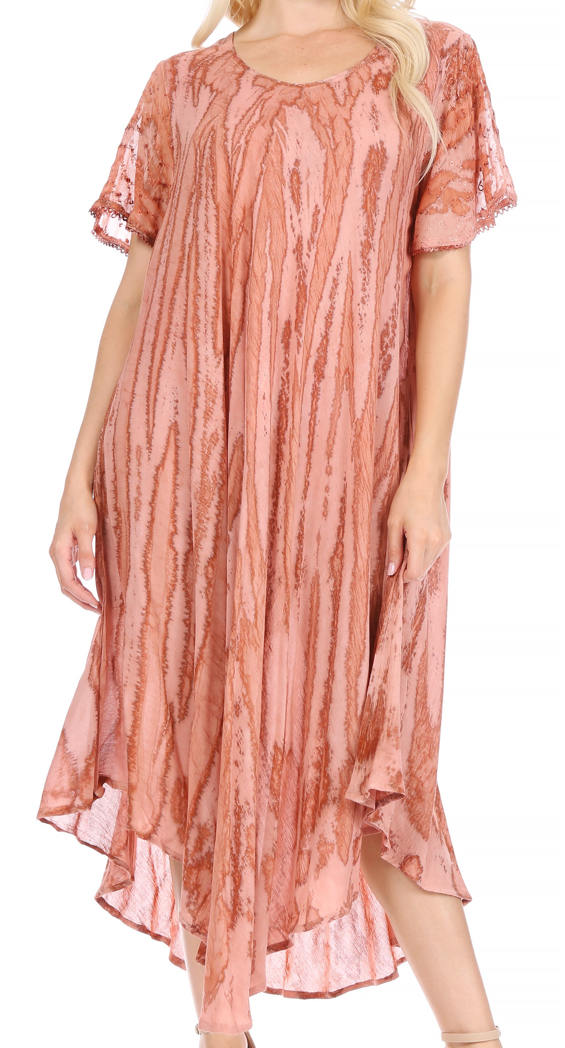 Woman wearing a pink patterned dress on a white background