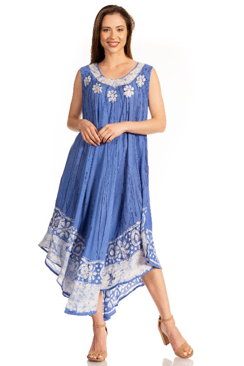 Woman wearing a blue dress with white floral patterns on a white background
