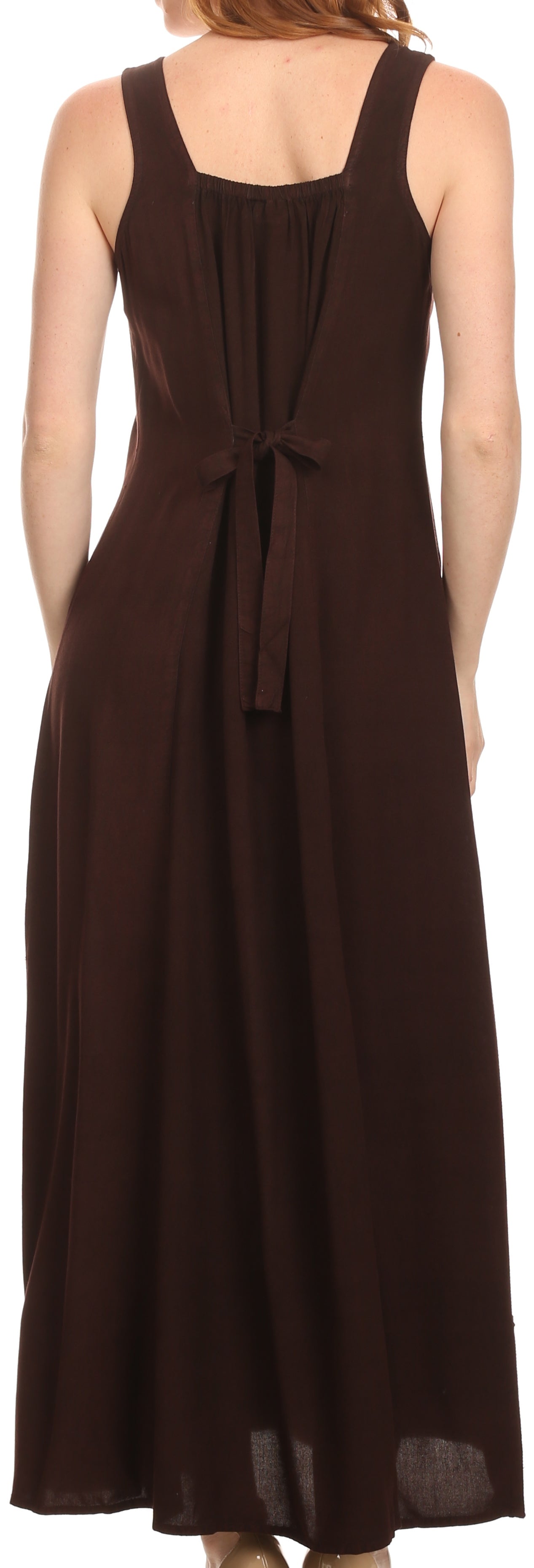 Brown sleeveless dress with a tie detail on a model