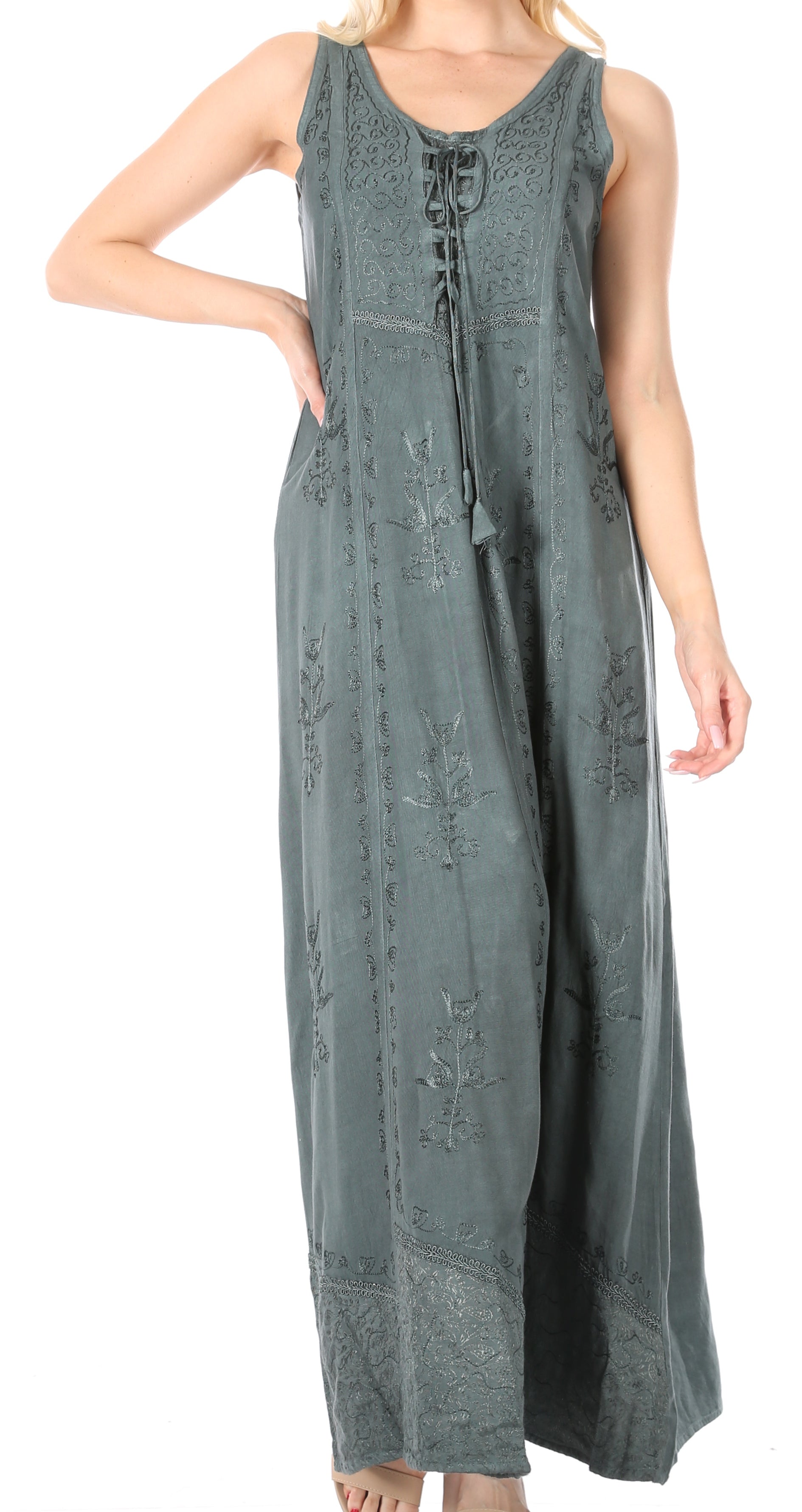 Long sleeveless green dress with lace details on a white background