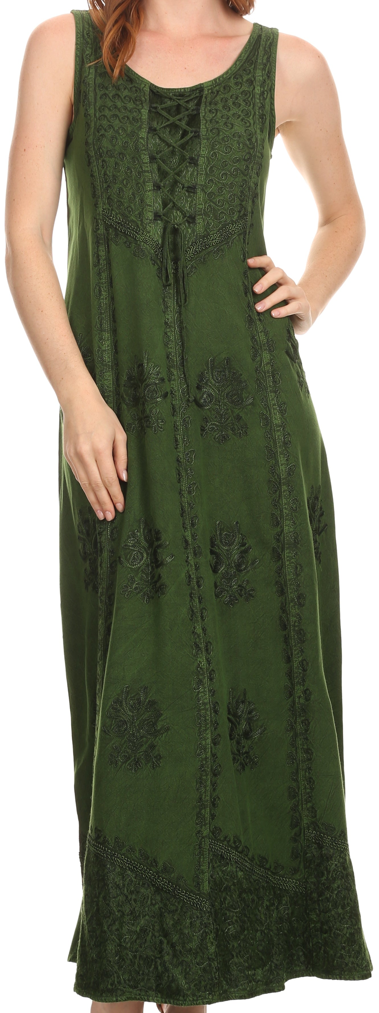 Woman wearing a green sleeveless dress with lace details.