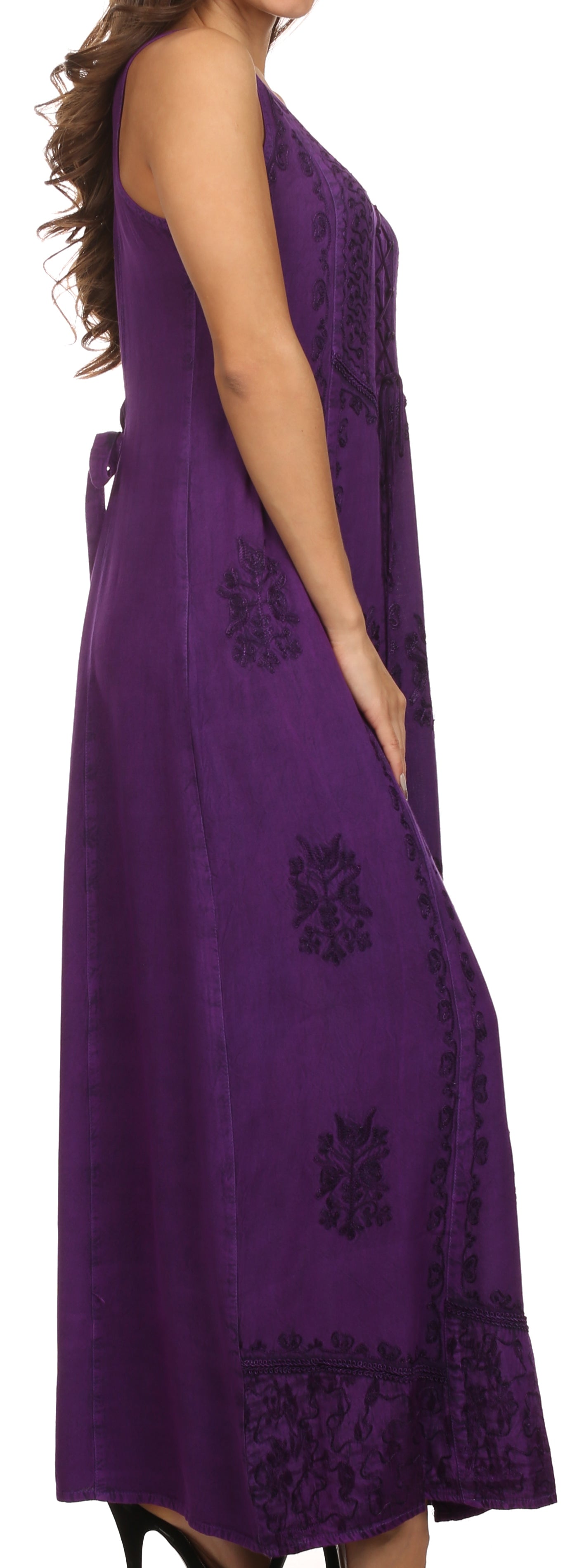 Purple dress with floral embroidery on a plain background