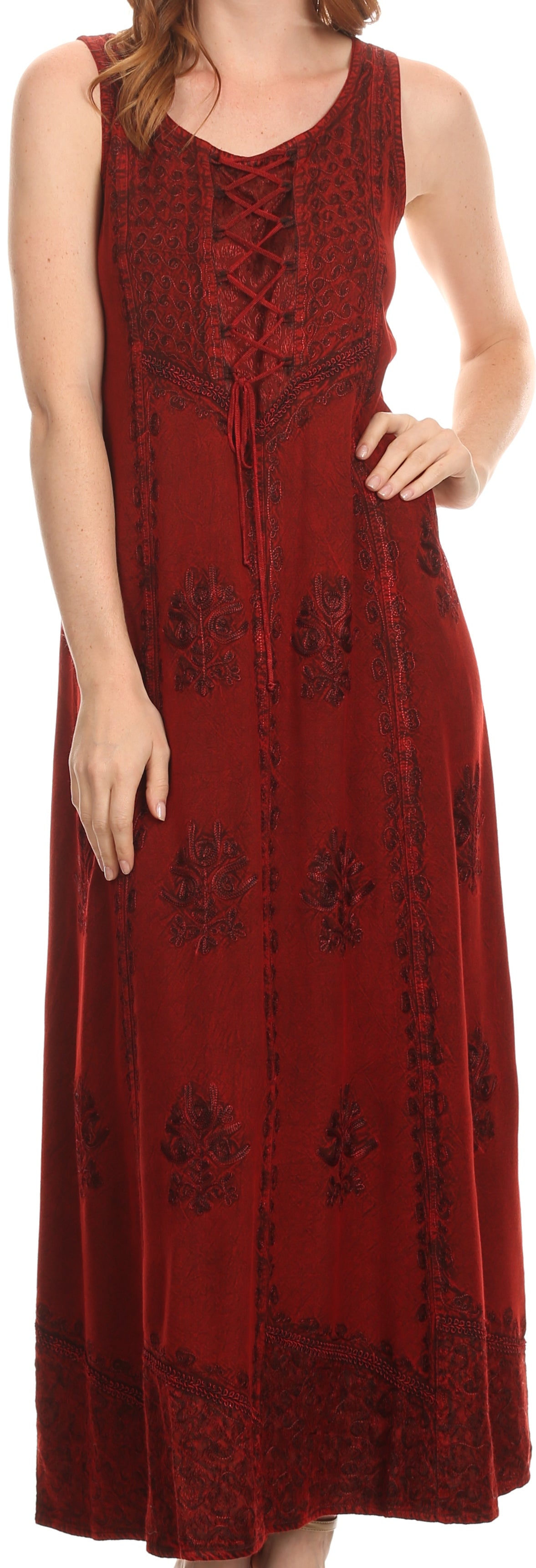 Woman wearing a red lace-up dress with floral patterns.