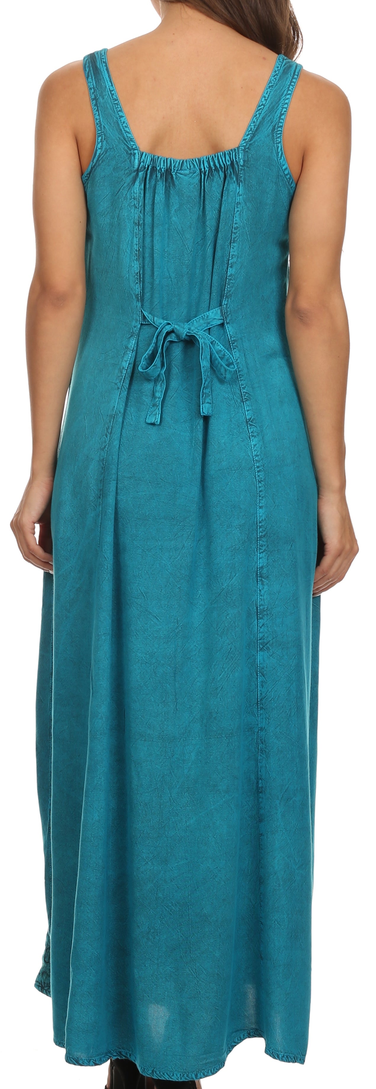Woman wearing a teal sleeveless dress with a drawstring waist.