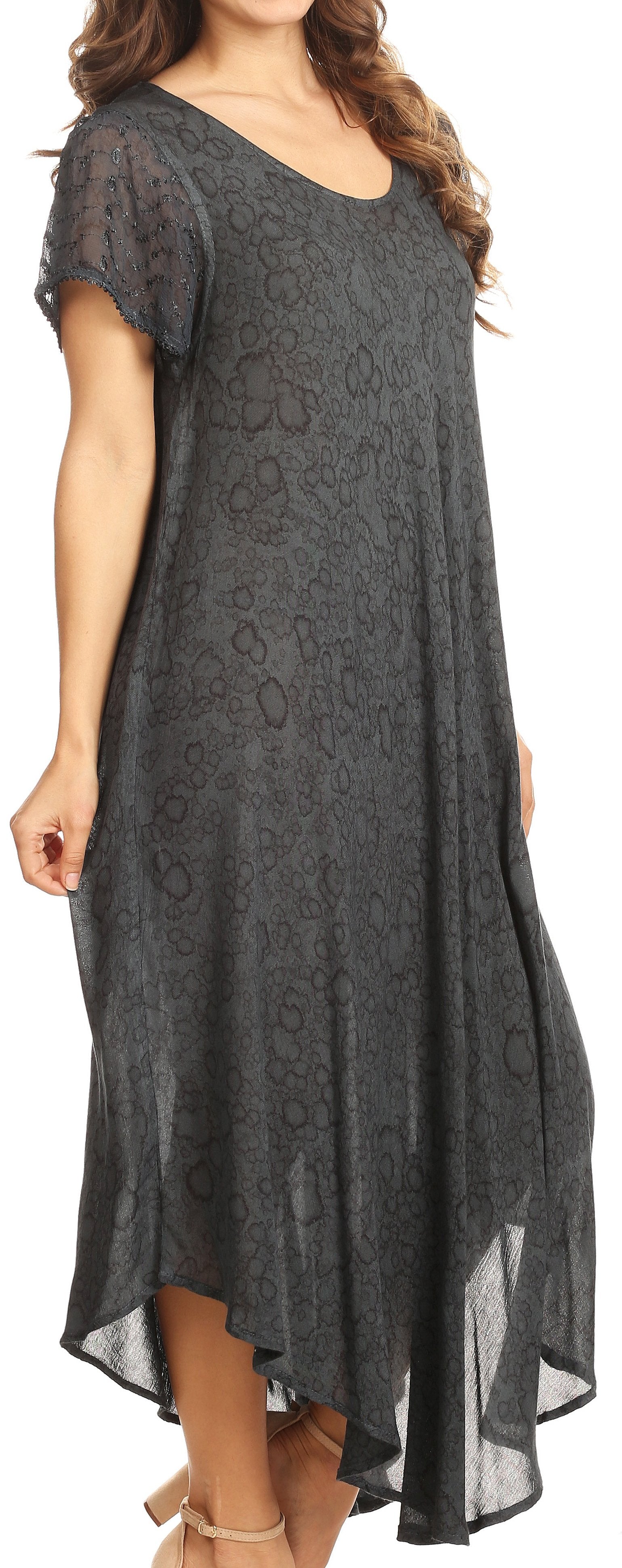 Woman wearing a dark gray lace dress on a white background