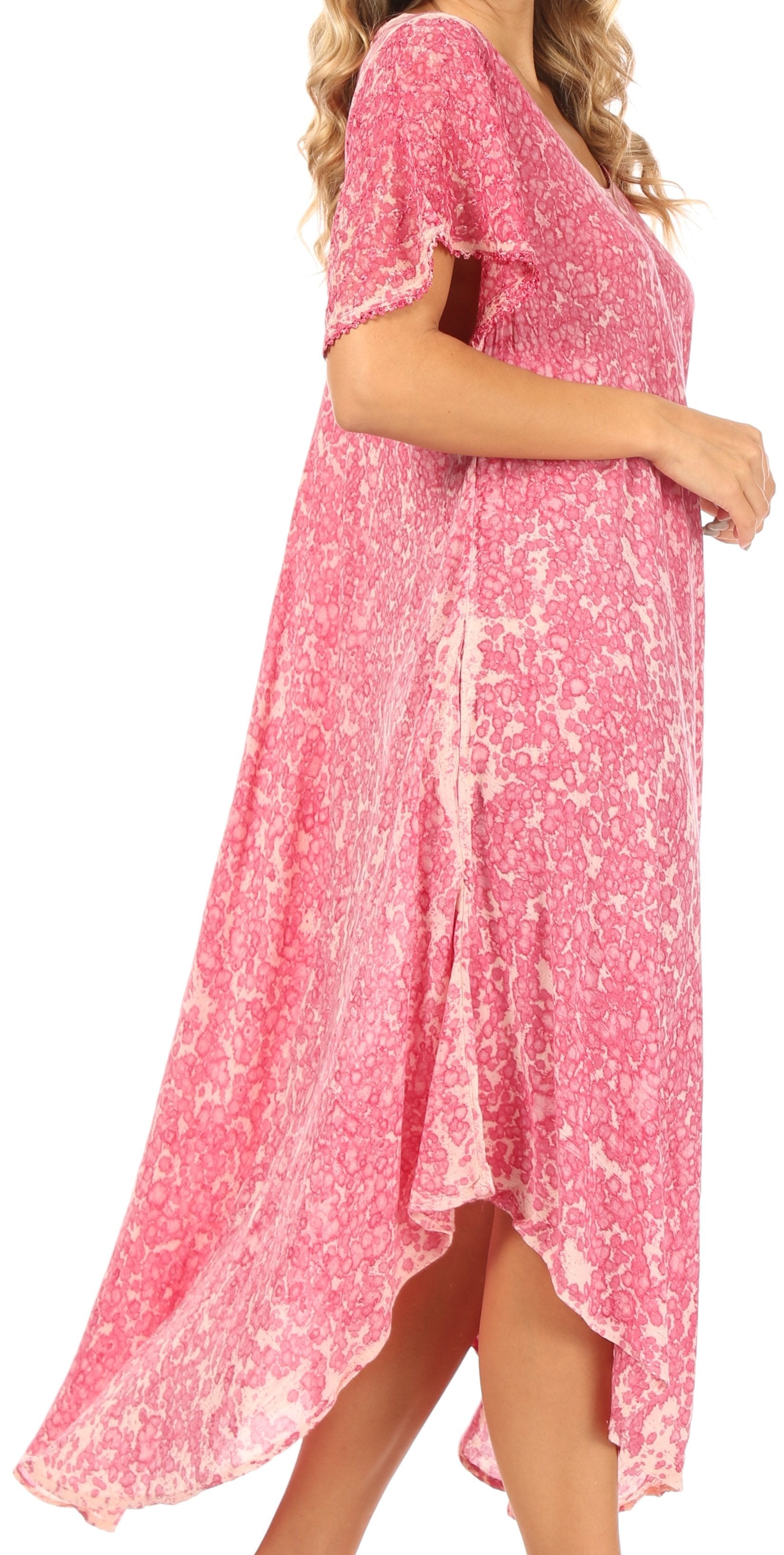 Pink floral dress worn by a person on a white background
